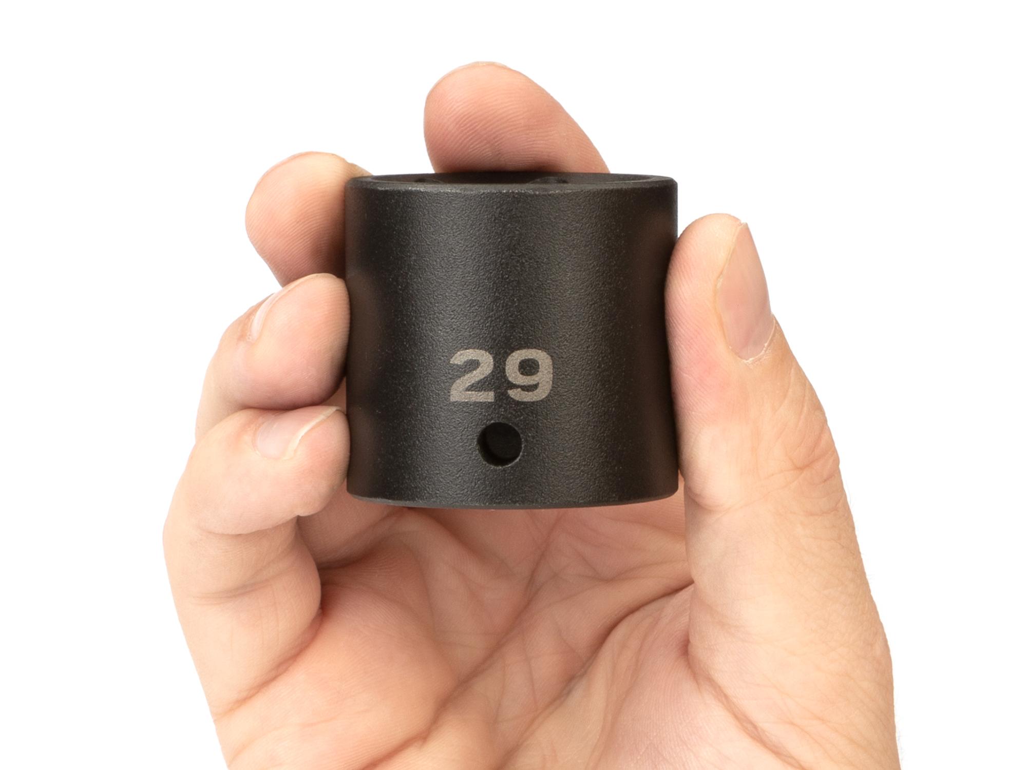 Person holding Tekton impact drive 6-point socket. Item #SID22129