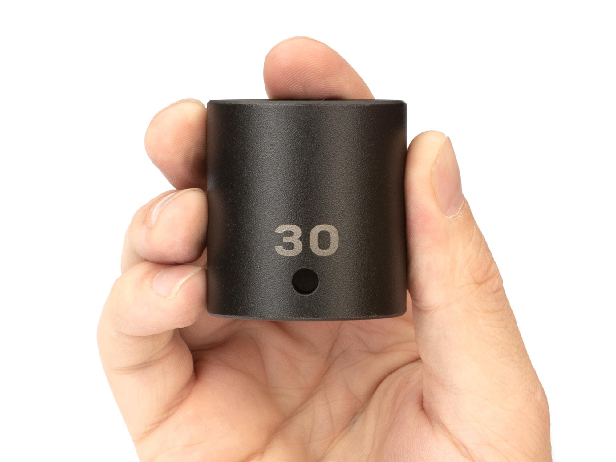 Person holding Tekton impact drive 6-point socket. Item #SID22130