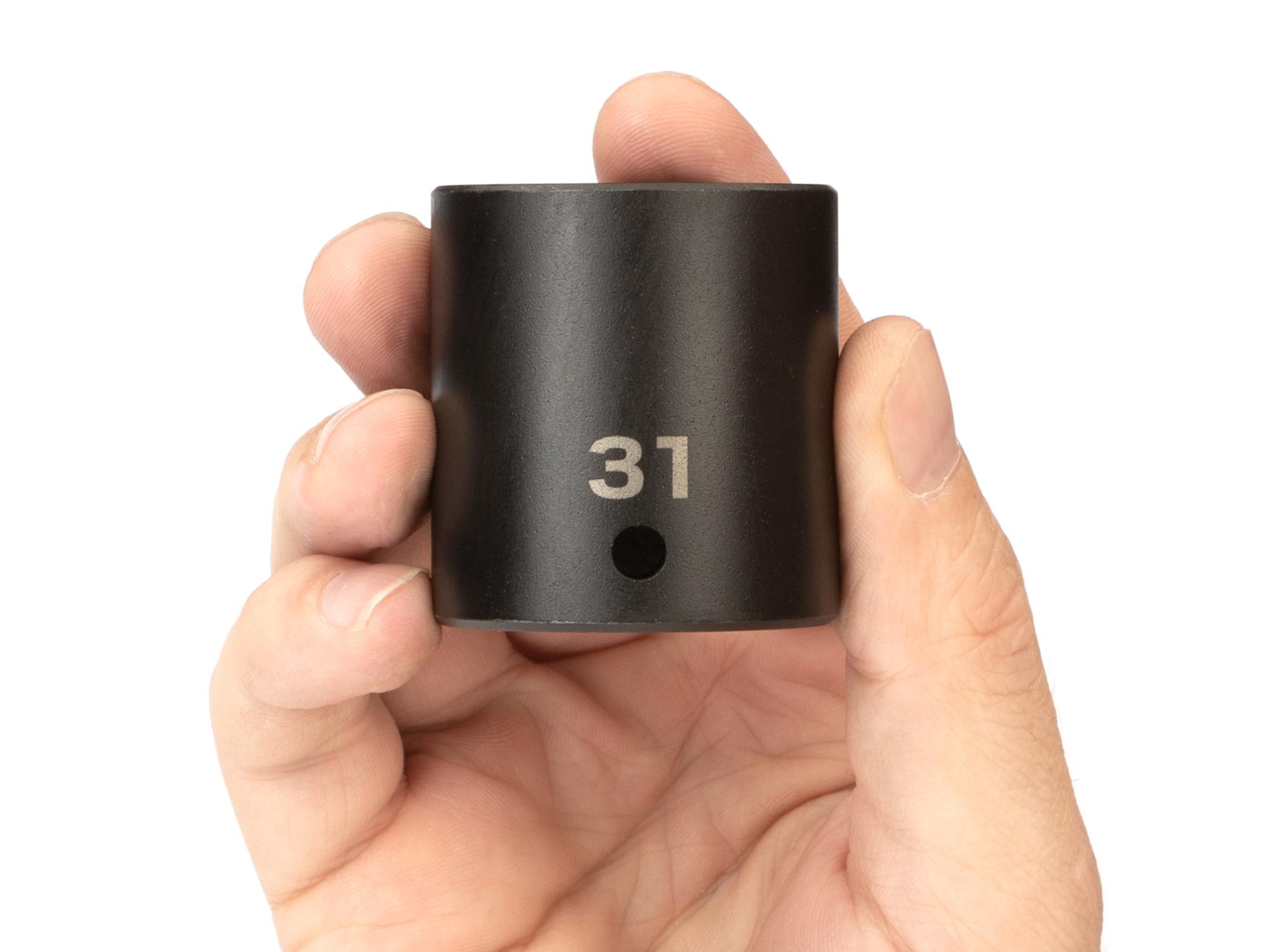 Person holding Tekton impact drive 6-point socket. Item #SID22131