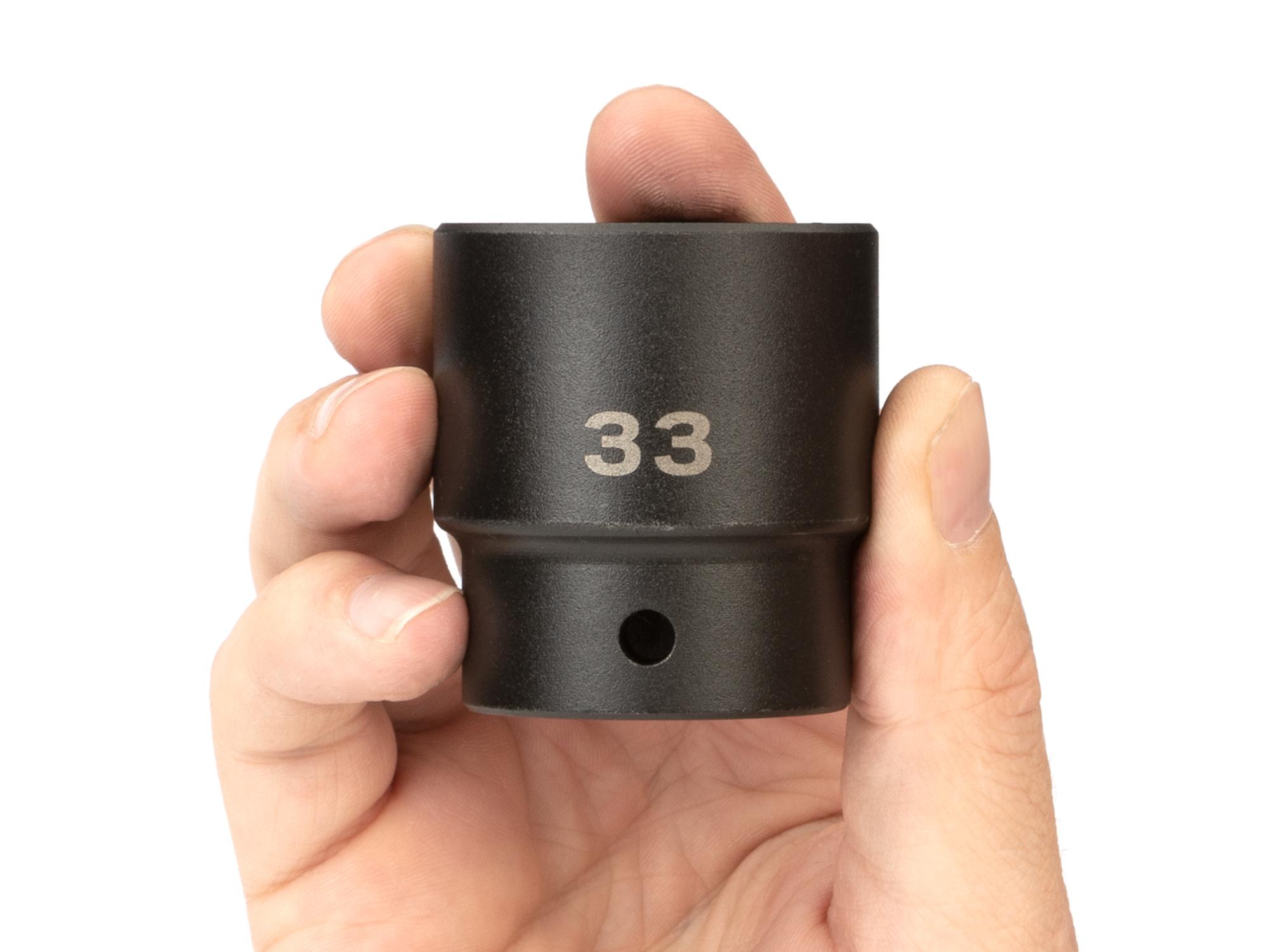 Person holding Tekton impact drive 6-point socket. Item #SID22133
