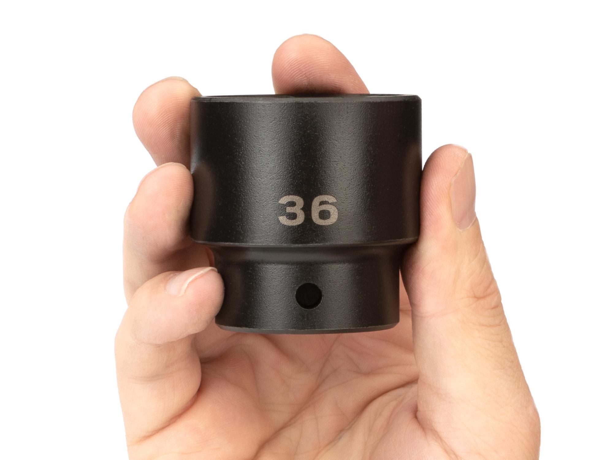 Person holding Tekton impact drive 6-point socket. Item #SID22136