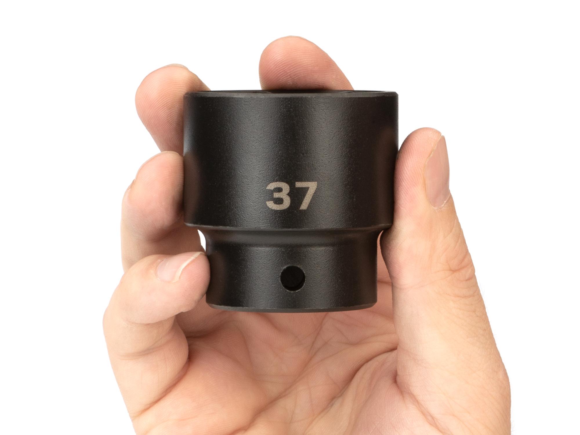 Person holding Tekton impact drive 6-point socket. Item #SID22137