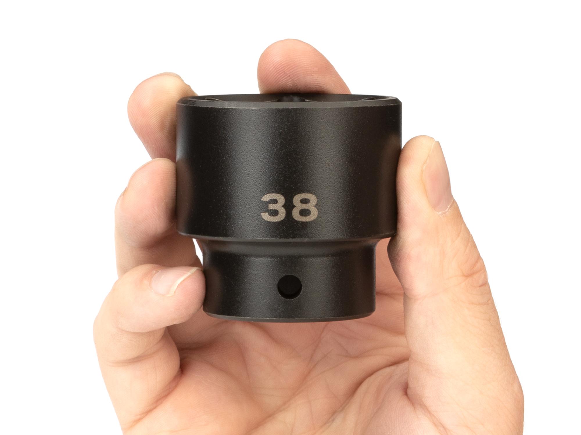 Person holding Tekton impact drive 6-point socket. Item #SID22138