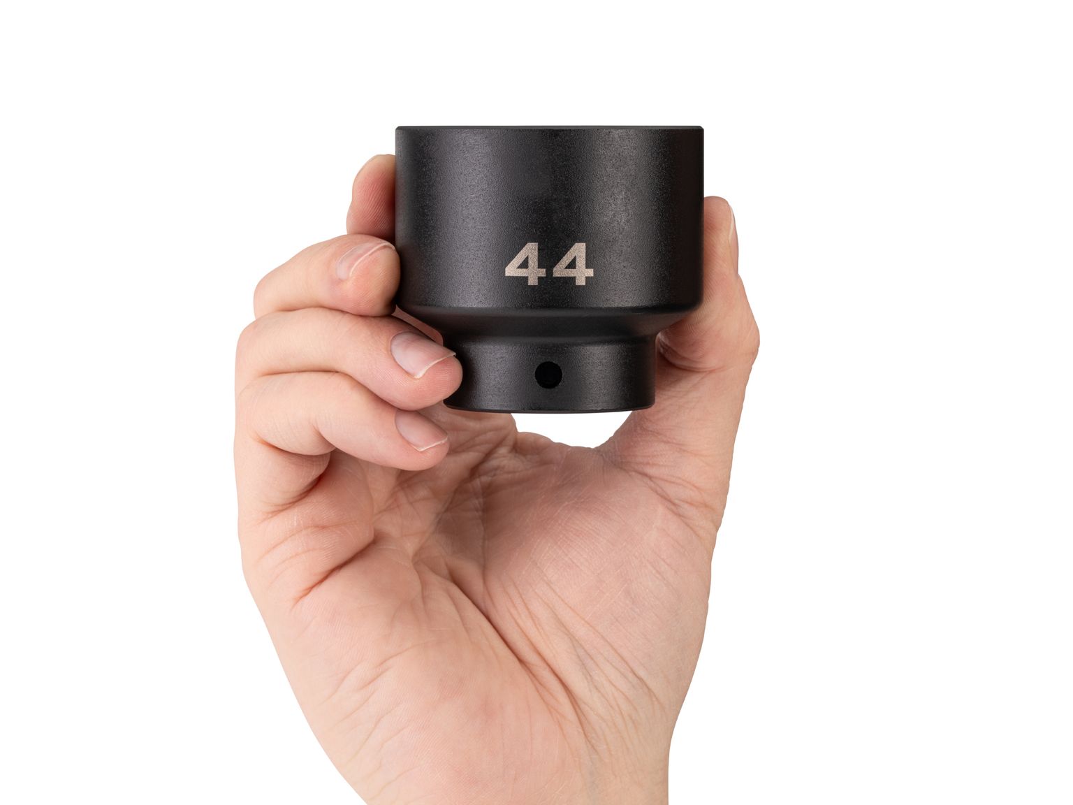 Person holding Tekton 44 millimeter impact drive 6-point socket. Item #SID22144