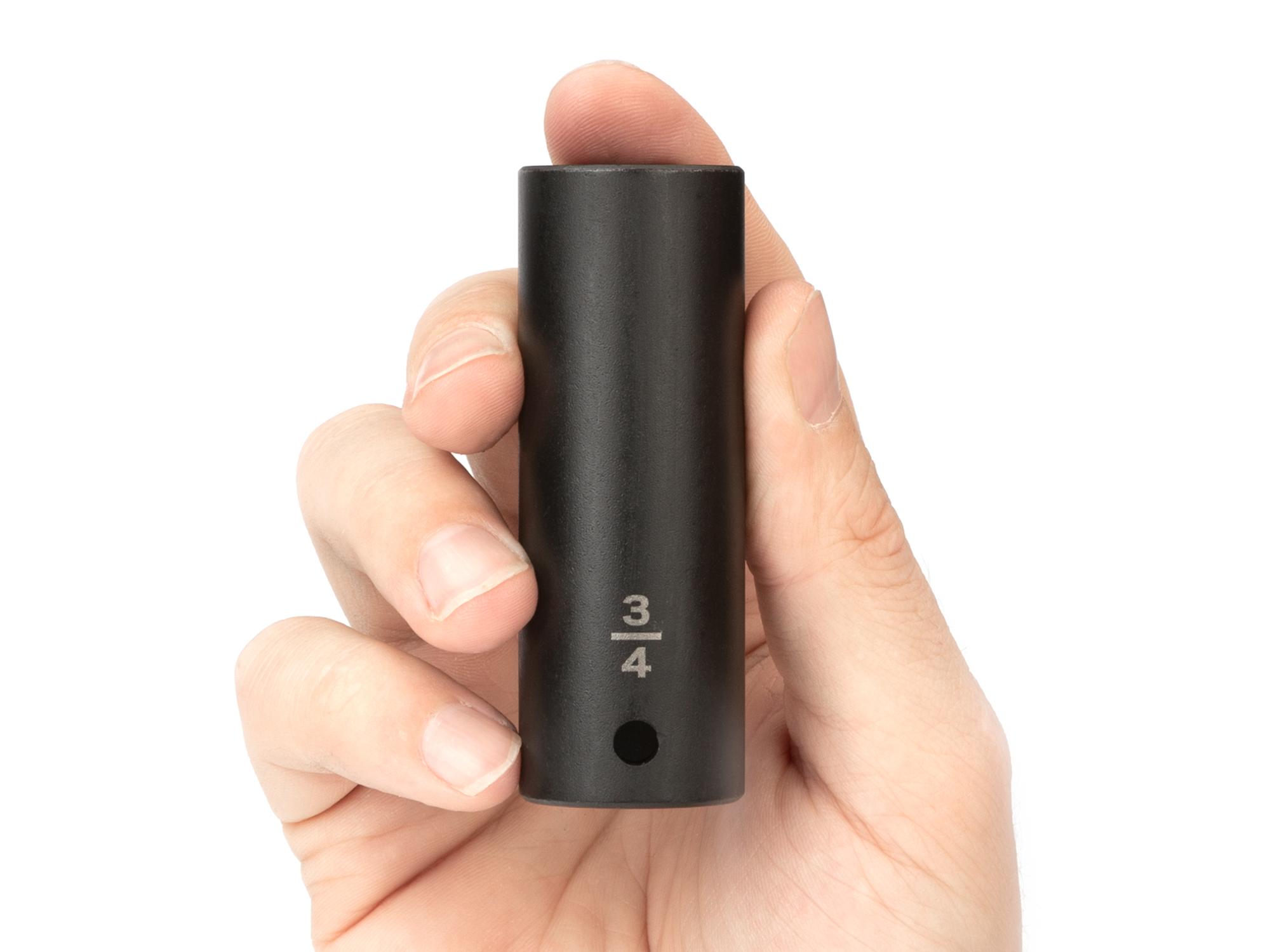 Person holding Tekton impact drive 6-point socket. Item #SID23019