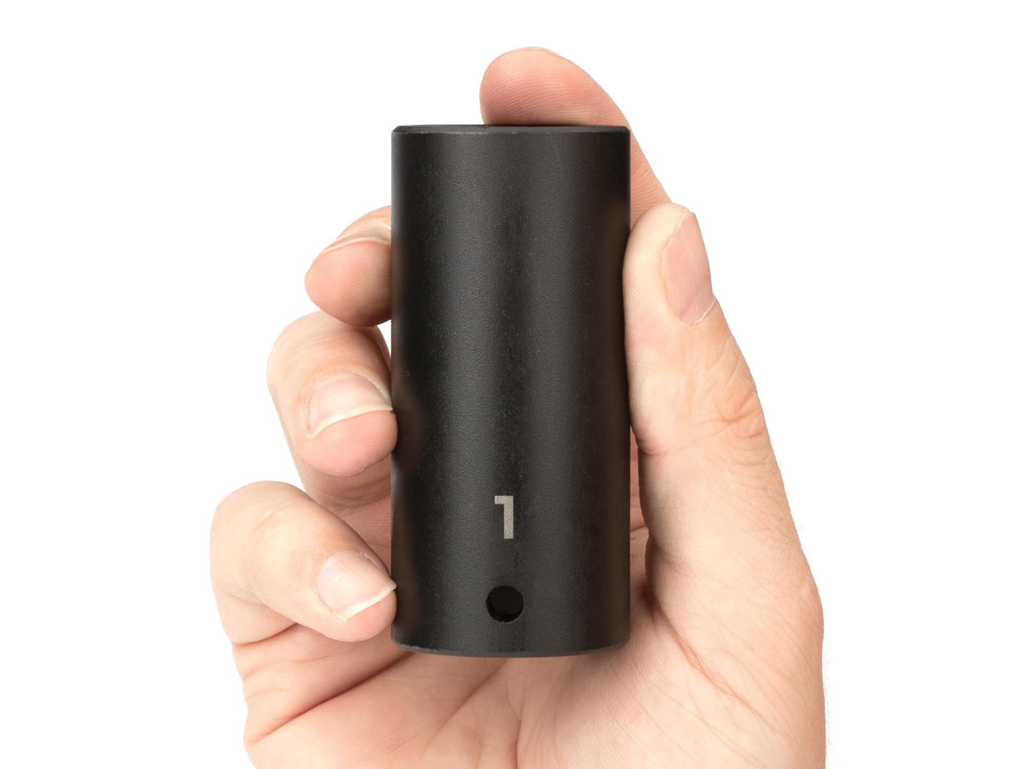 Person holding Tekton impact drive 6-point socket. Item #SID23025