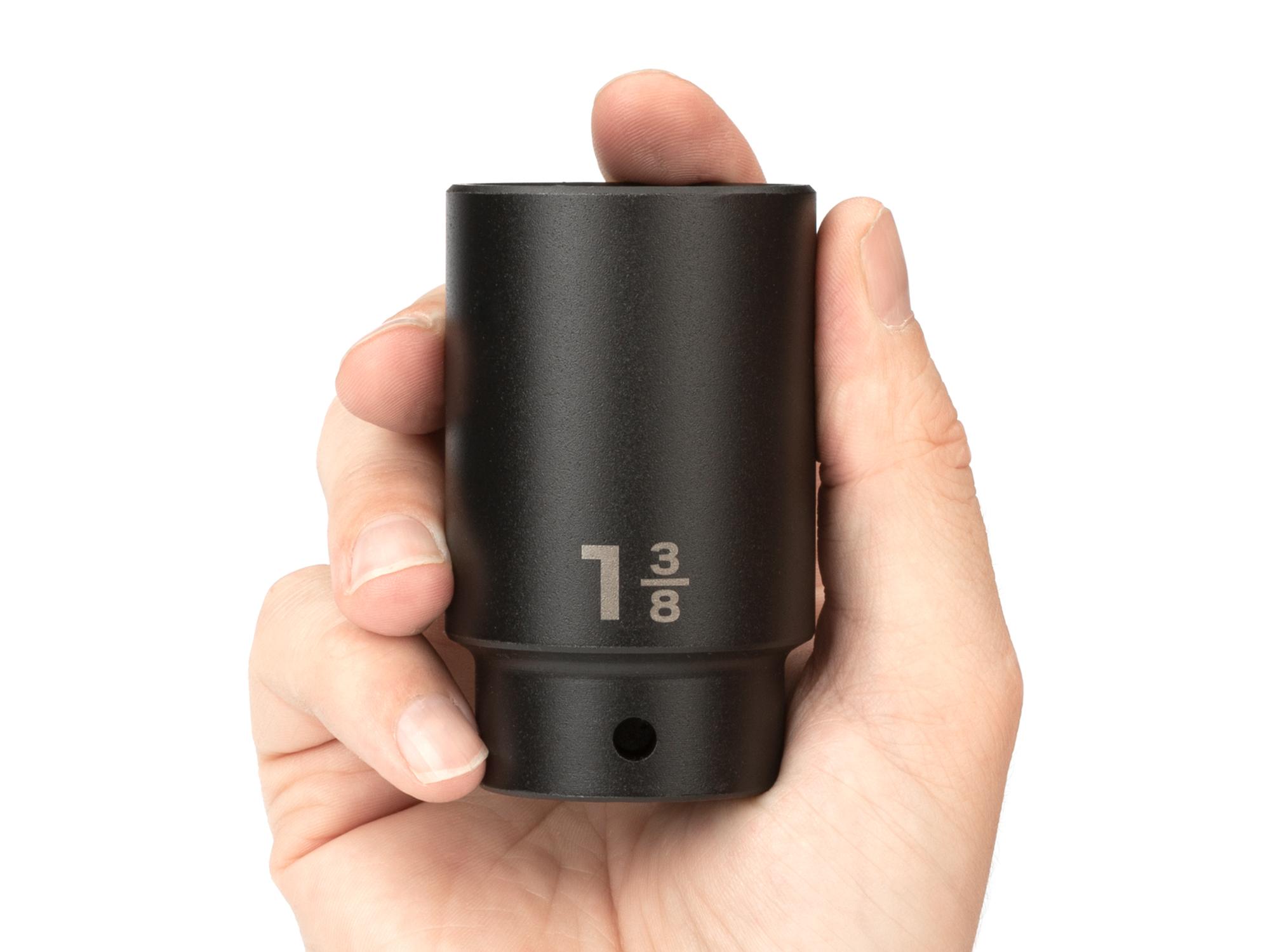Person holding Tekton impact drive 6-point socket. Item #SID23035