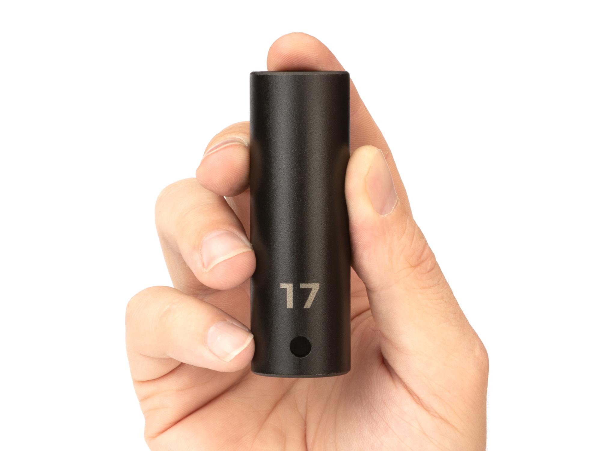 Person holding Tekton impact drive 6-point socket. Item #SID23117