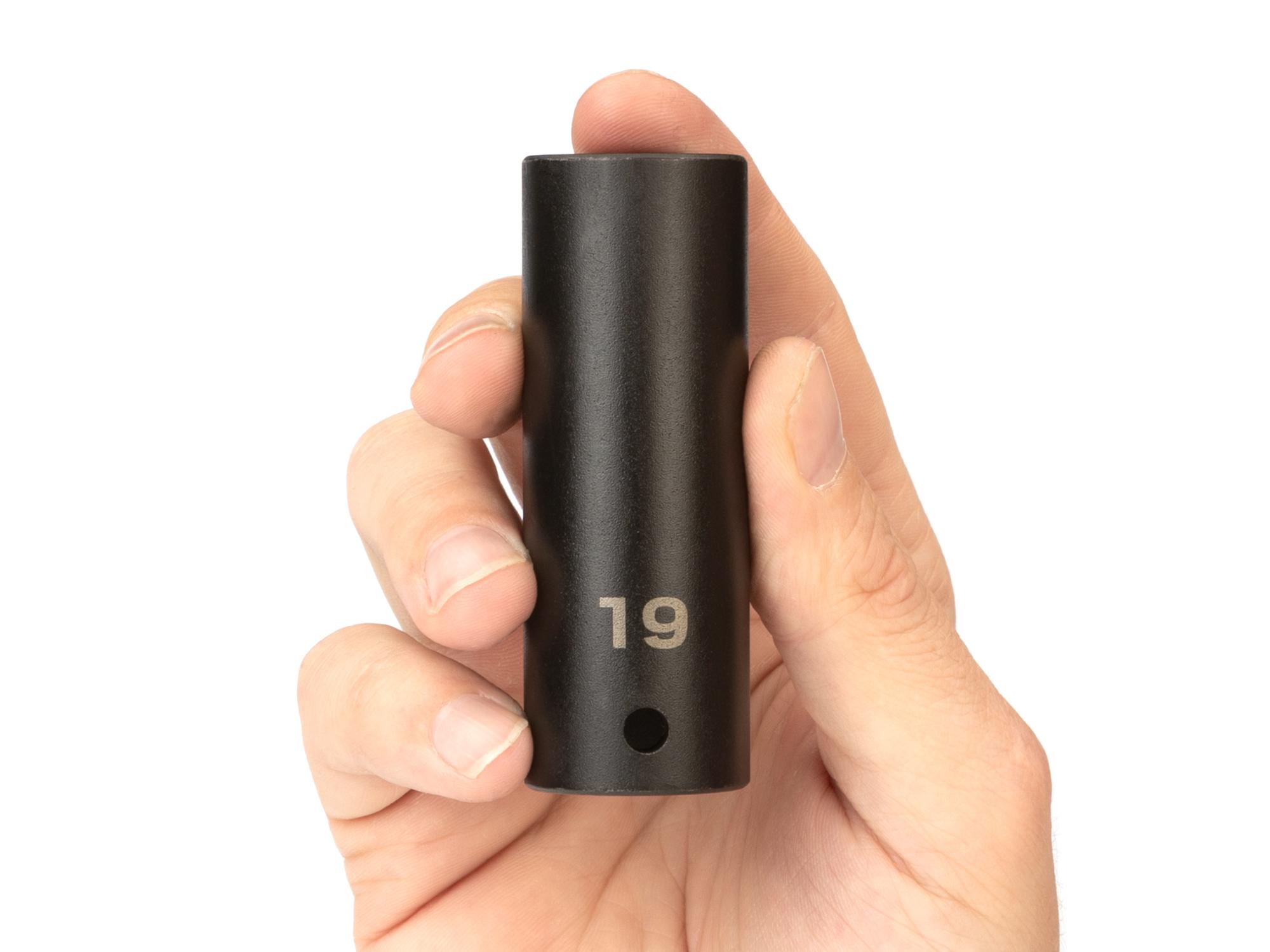 Person holding Tekton impact drive 6-point socket. Item #SID23119