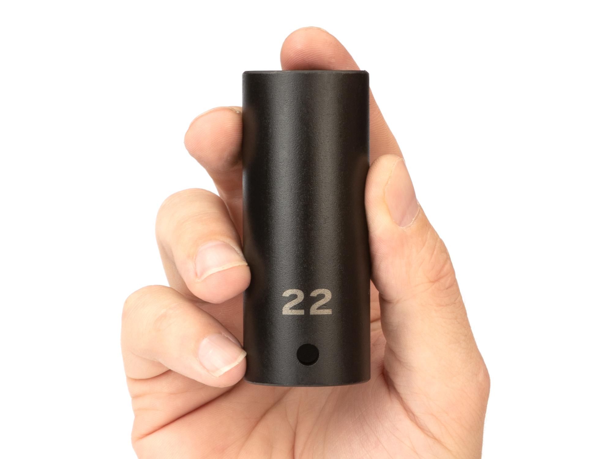 Person holding Tekton impact drive 6-point socket. Item #SID23122
