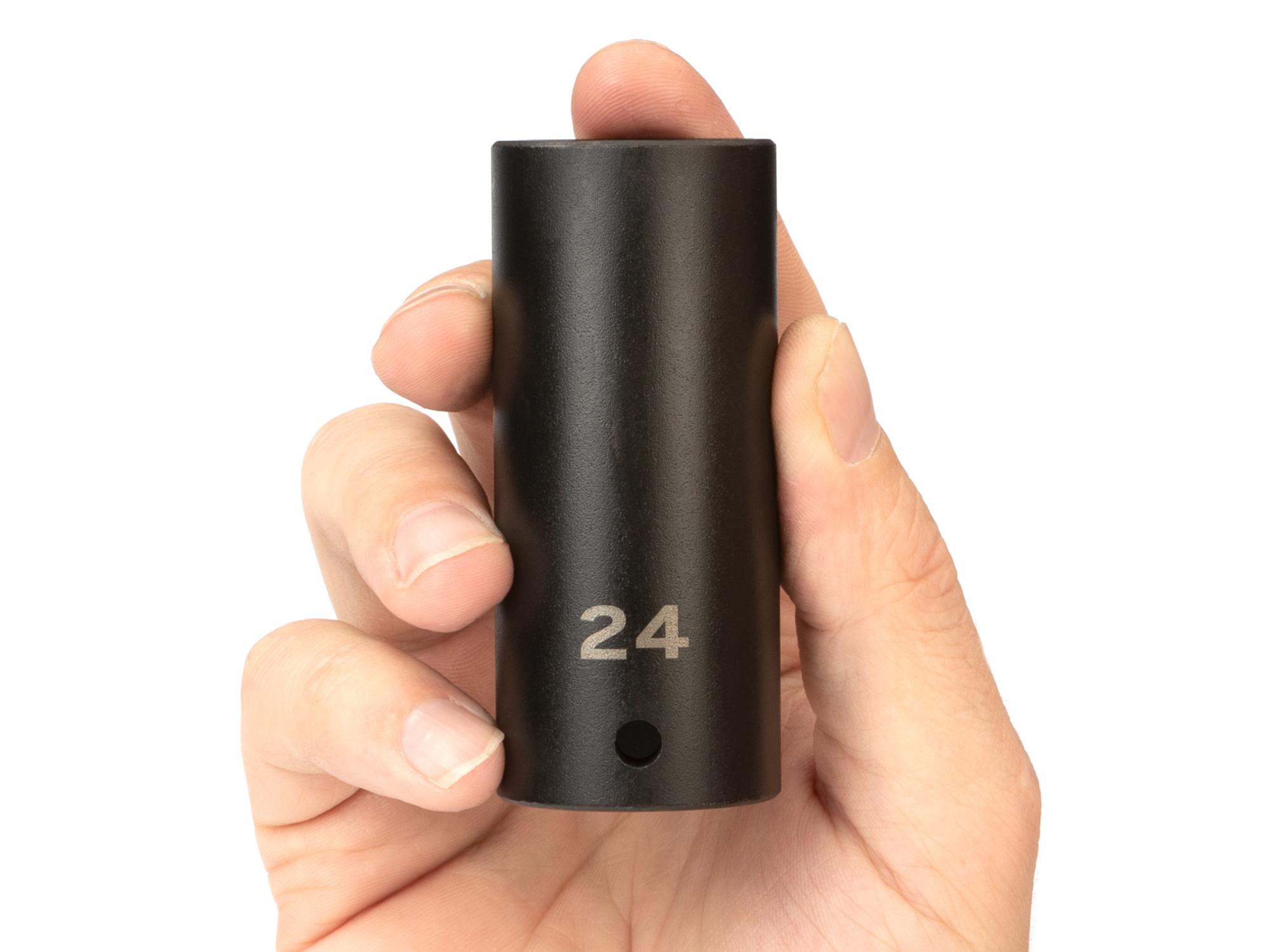Person holding Tekton impact drive 6-point socket. Item #SID23124
