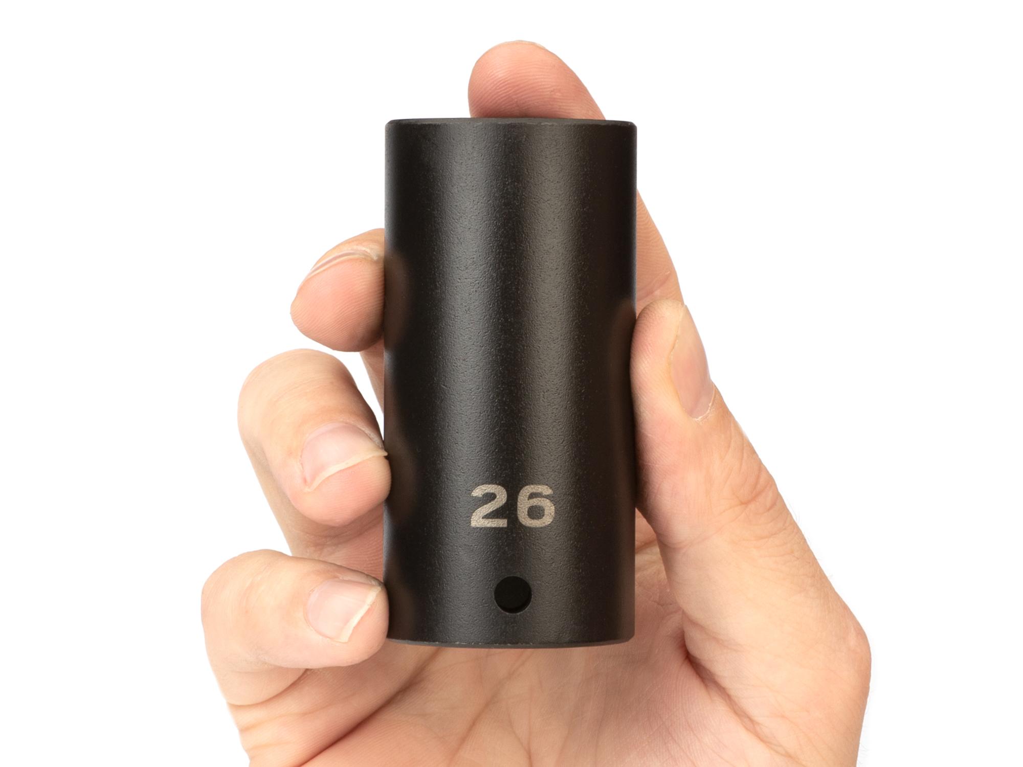 Person holding Tekton impact drive 6-point socket. Item #SID23126