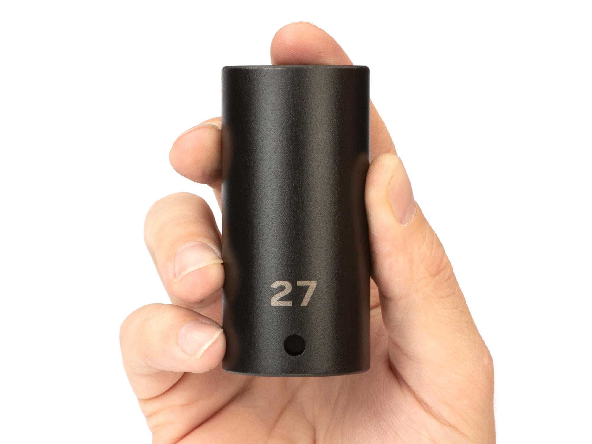 Person holding Tekton impact drive 6-point socket. Item #SID23127