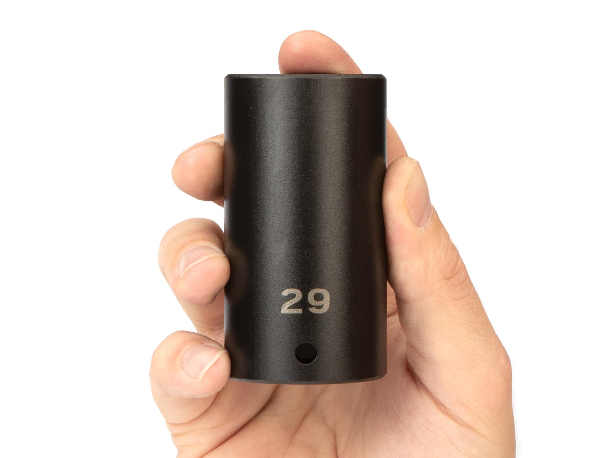 Person holding Tekton impact drive 6-point socket. Item #SID23129