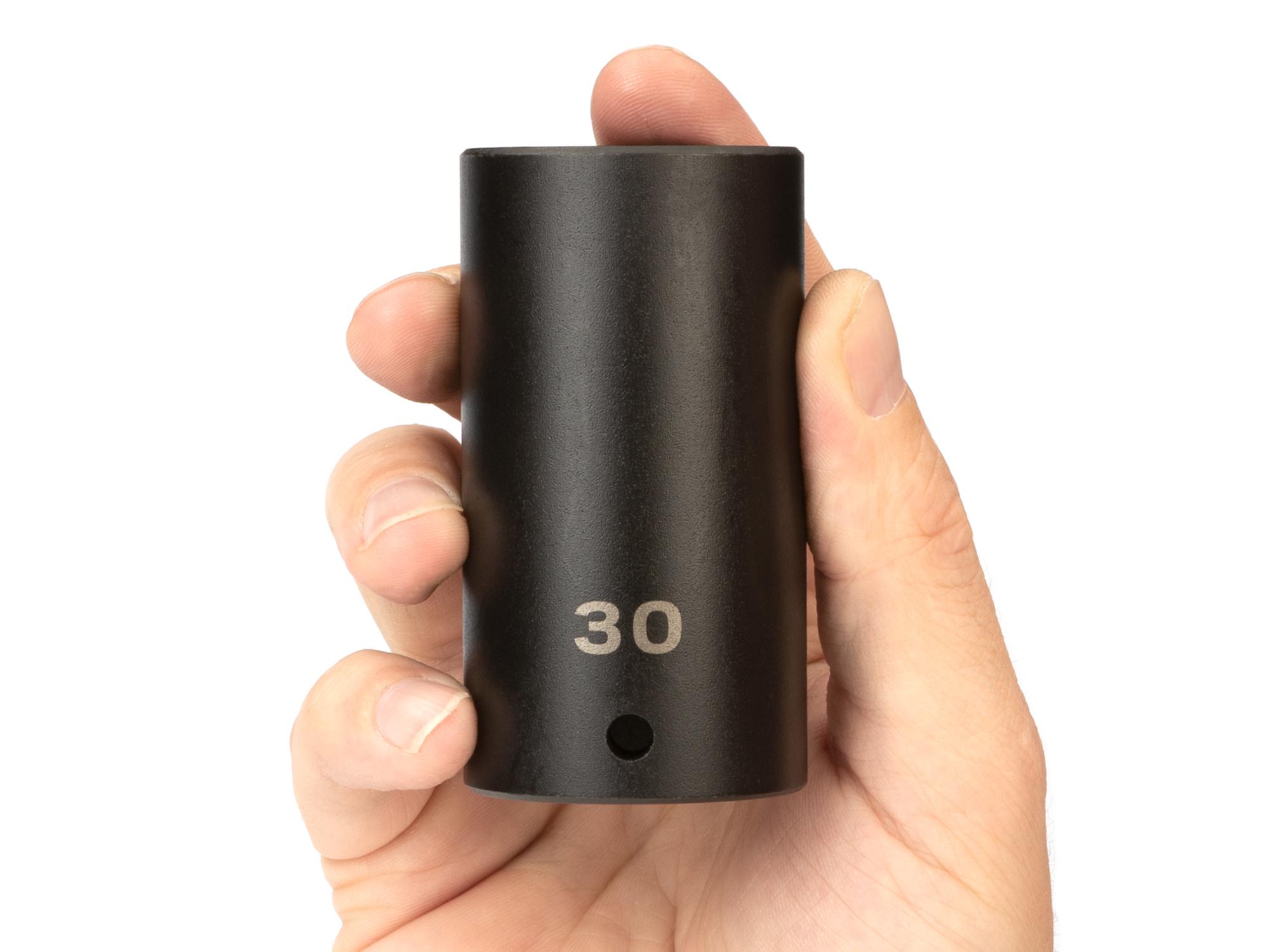 Person holding Tekton impact drive 6-point socket. Item #SID23130