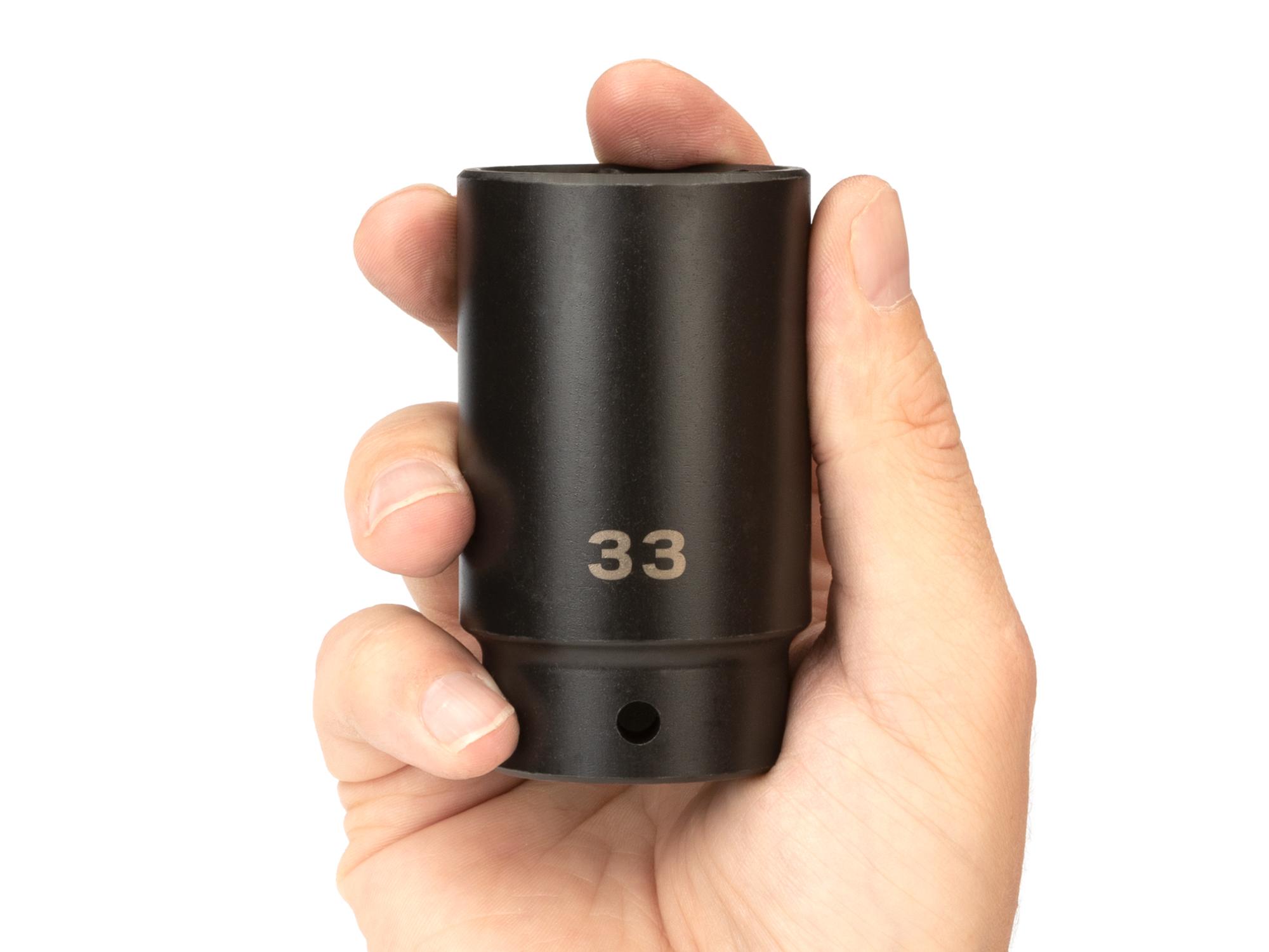 Person holding Tekton impact drive 6-point socket. Item #SID23133