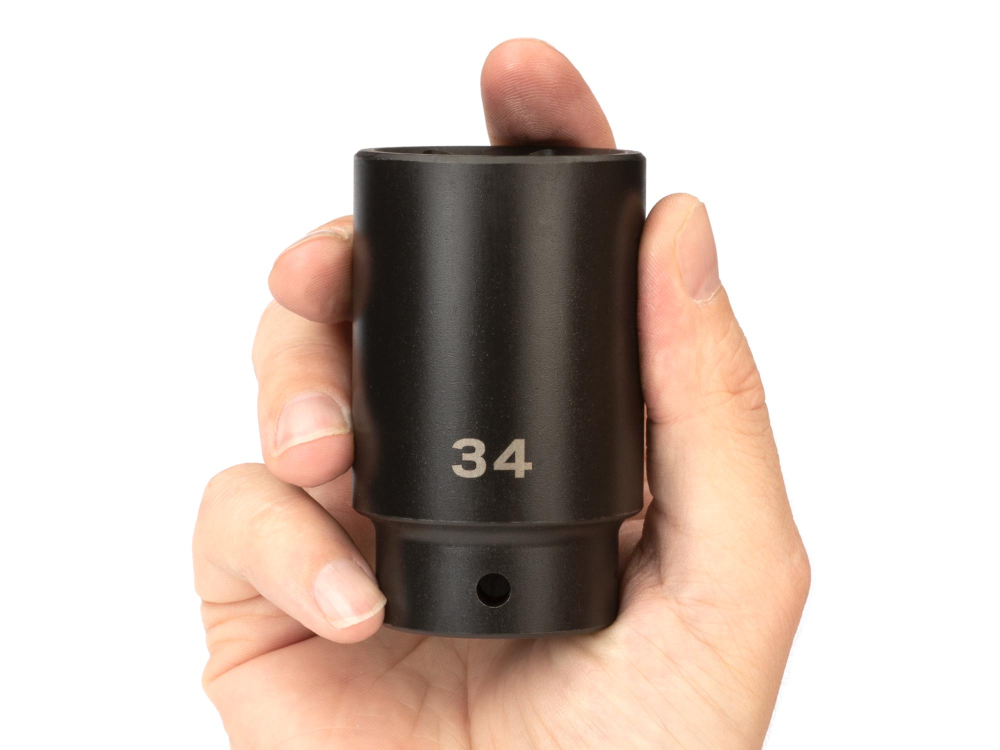 Person holding Tekton impact drive 6-point socket. Item #SID23134