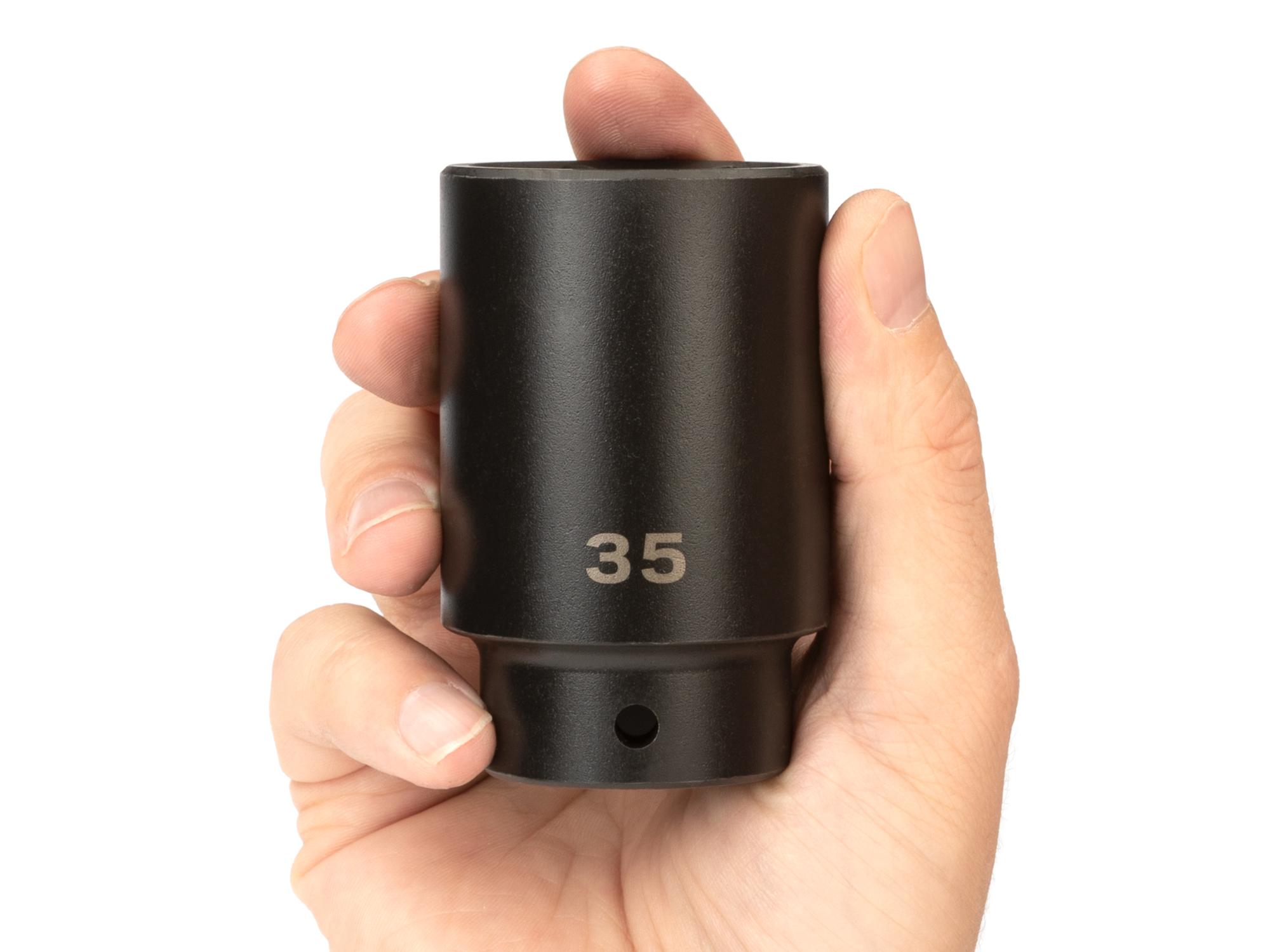 Person holding Tekton impact drive 6-point socket. Item #SID23135