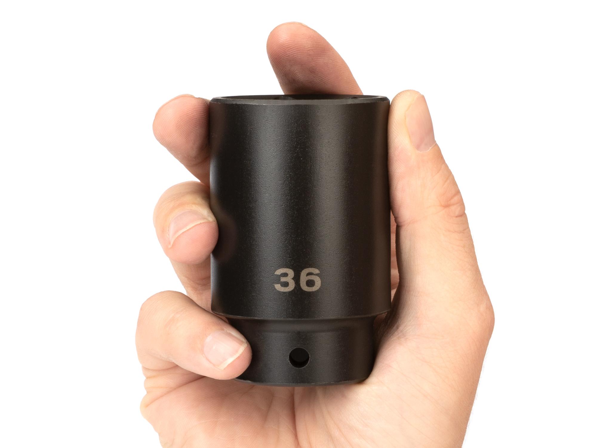 Person holding Tekton impact drive 6-point socket. Item #SID23136