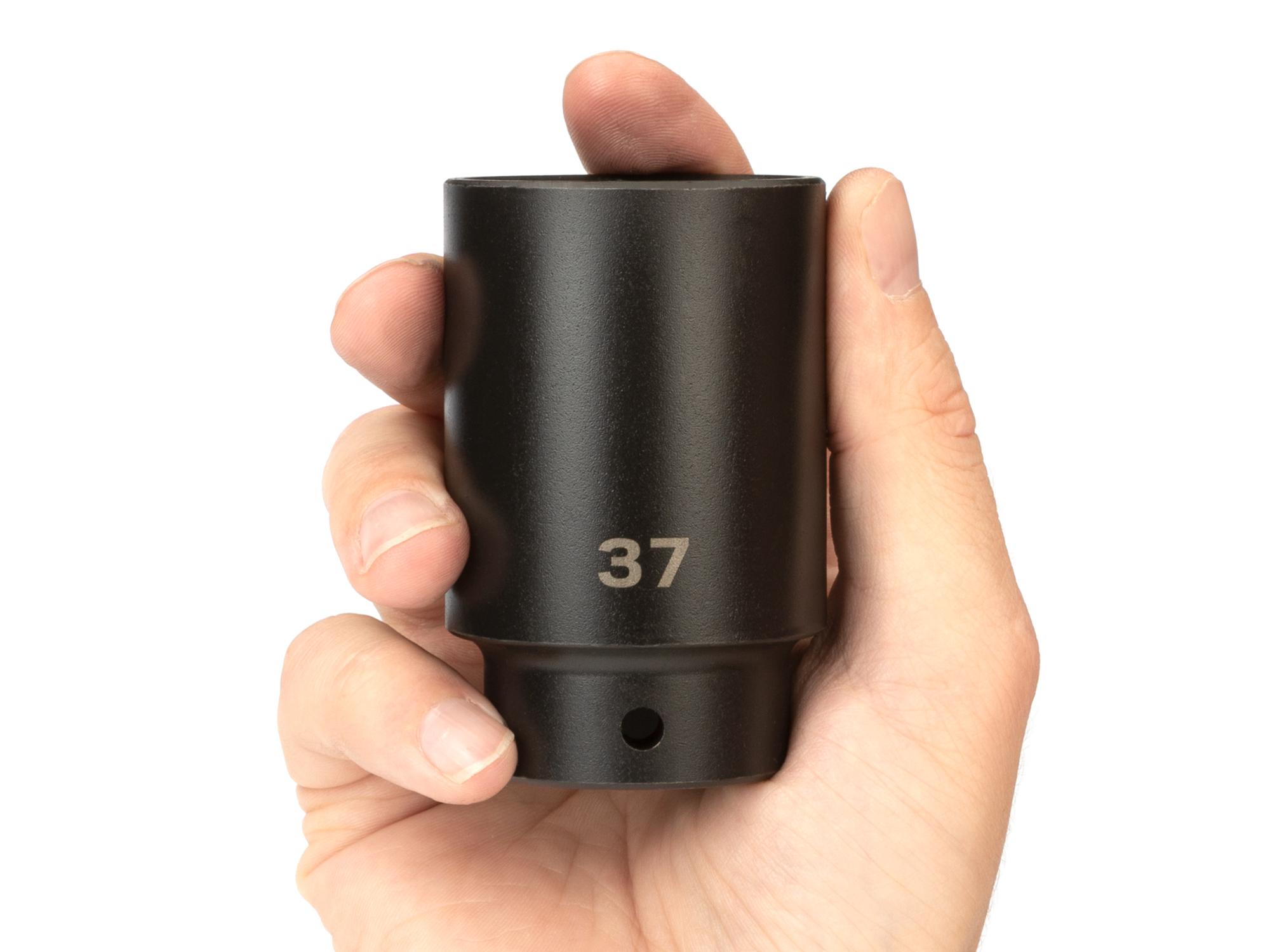 Person holding Tekton impact drive 6-point socket. Item #SID23137