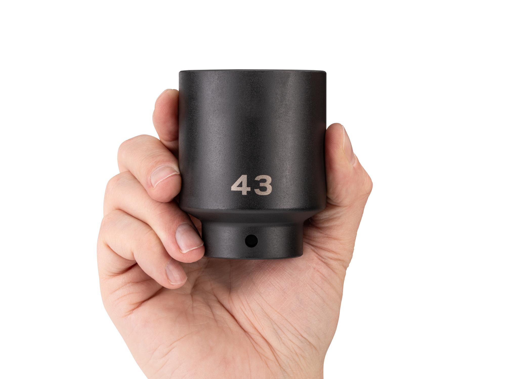 Person holding Tekton impact drive 6-point socket. Item #SID23143