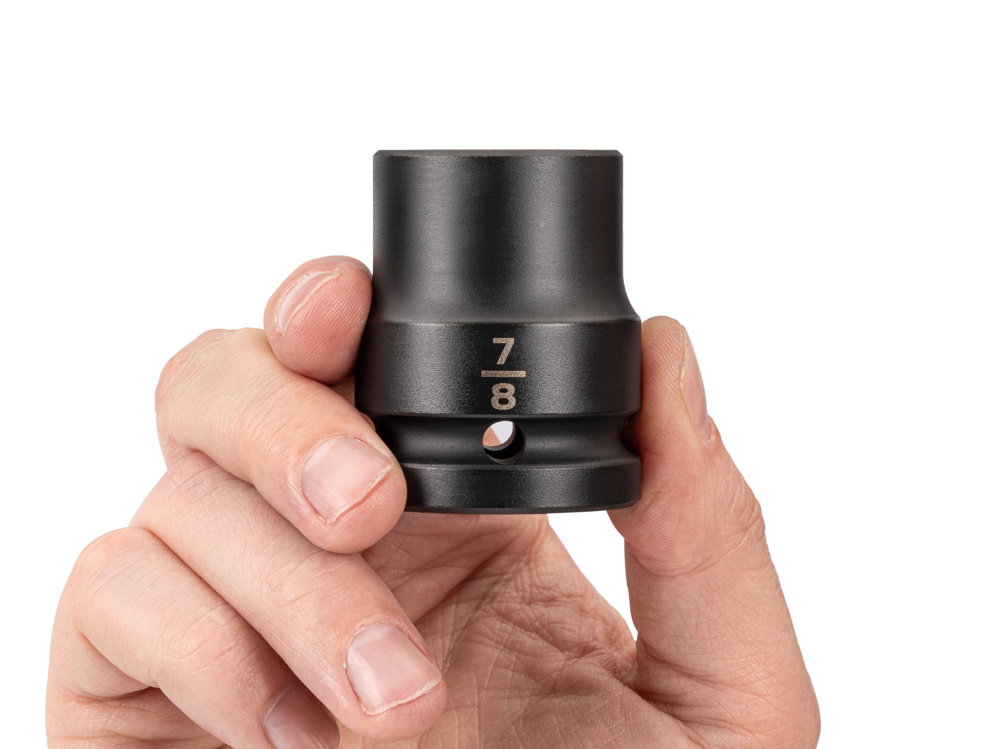 Person holding Tekton impact drive 6-point socket. Item #SID32022