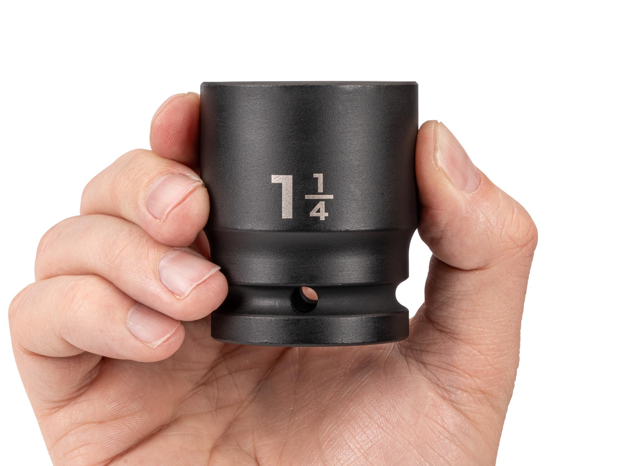 Person holding Tekton impact drive 6-point socket. Item #SID32032