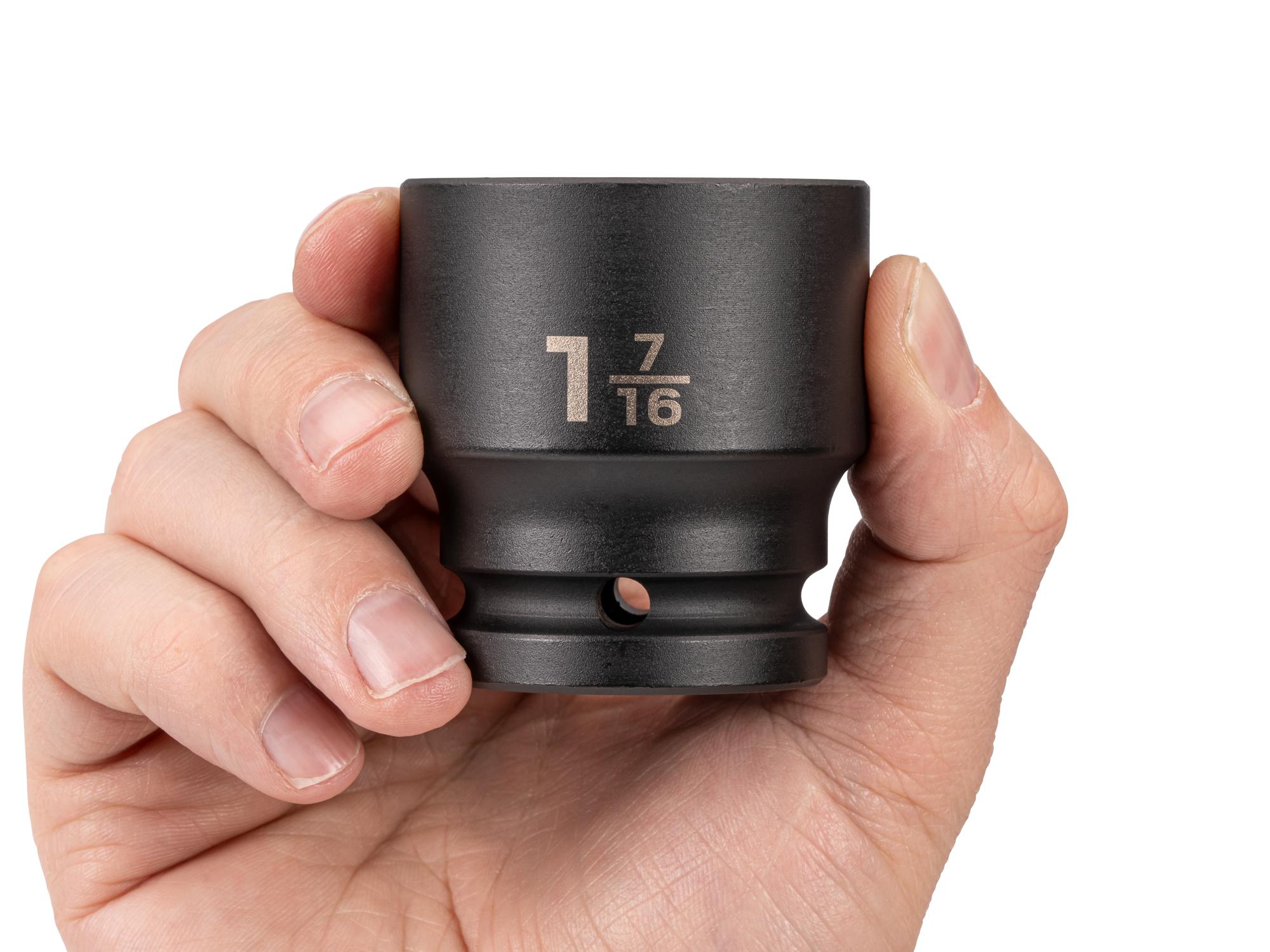 Person holding Tekton impact drive 6-point socket. Item #SID32036