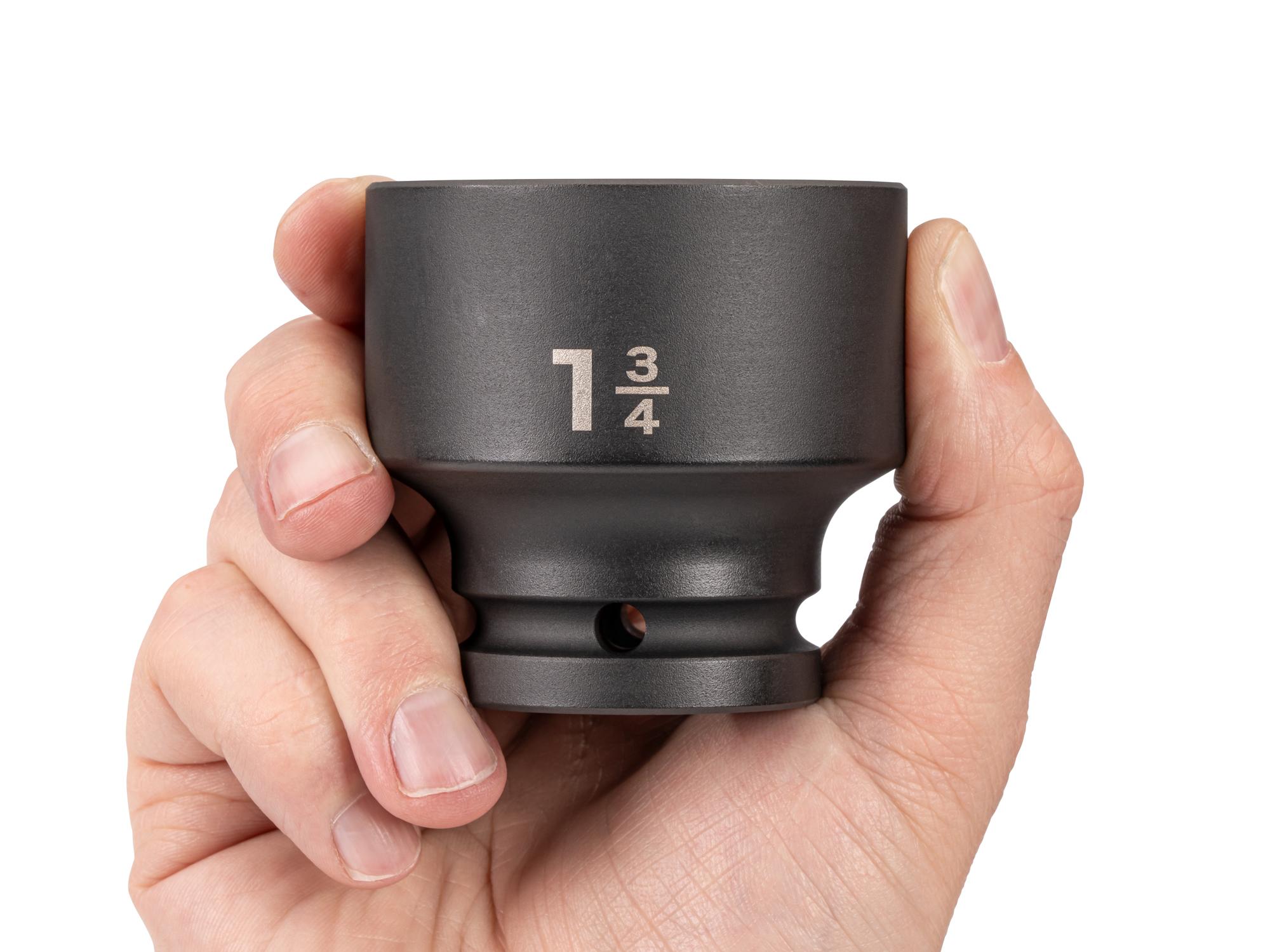 Person holding Tekton impact drive 6-point socket. Item #SID32045