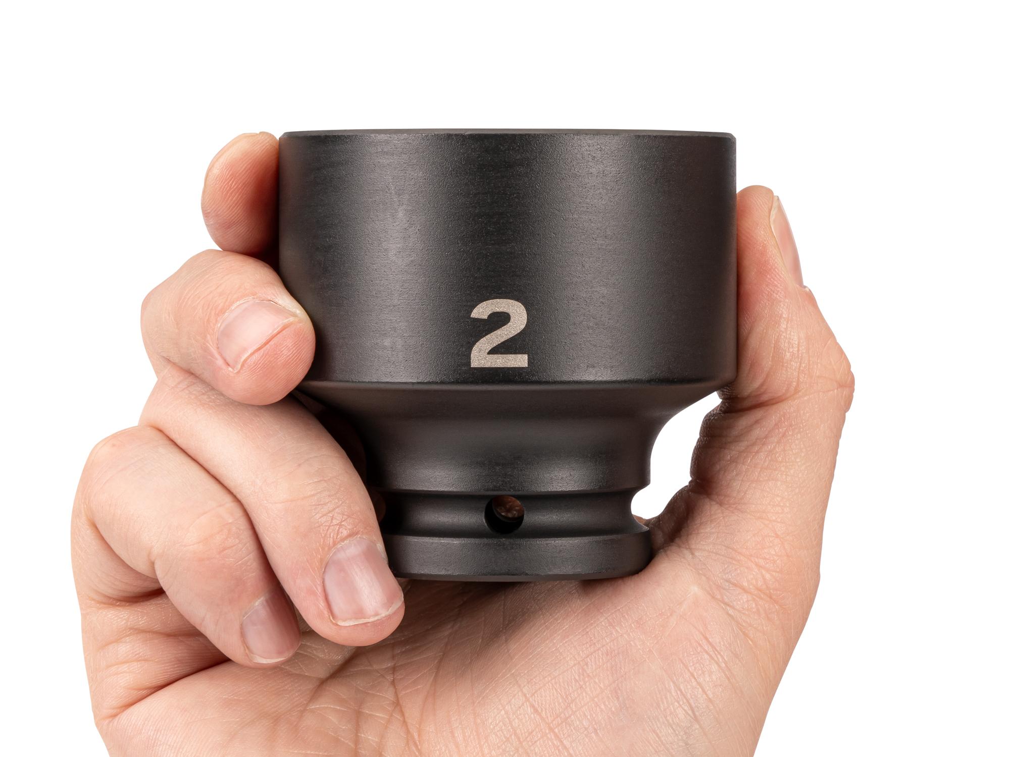 Person holding Tekton impact drive 6-point socket. Item #SID32051