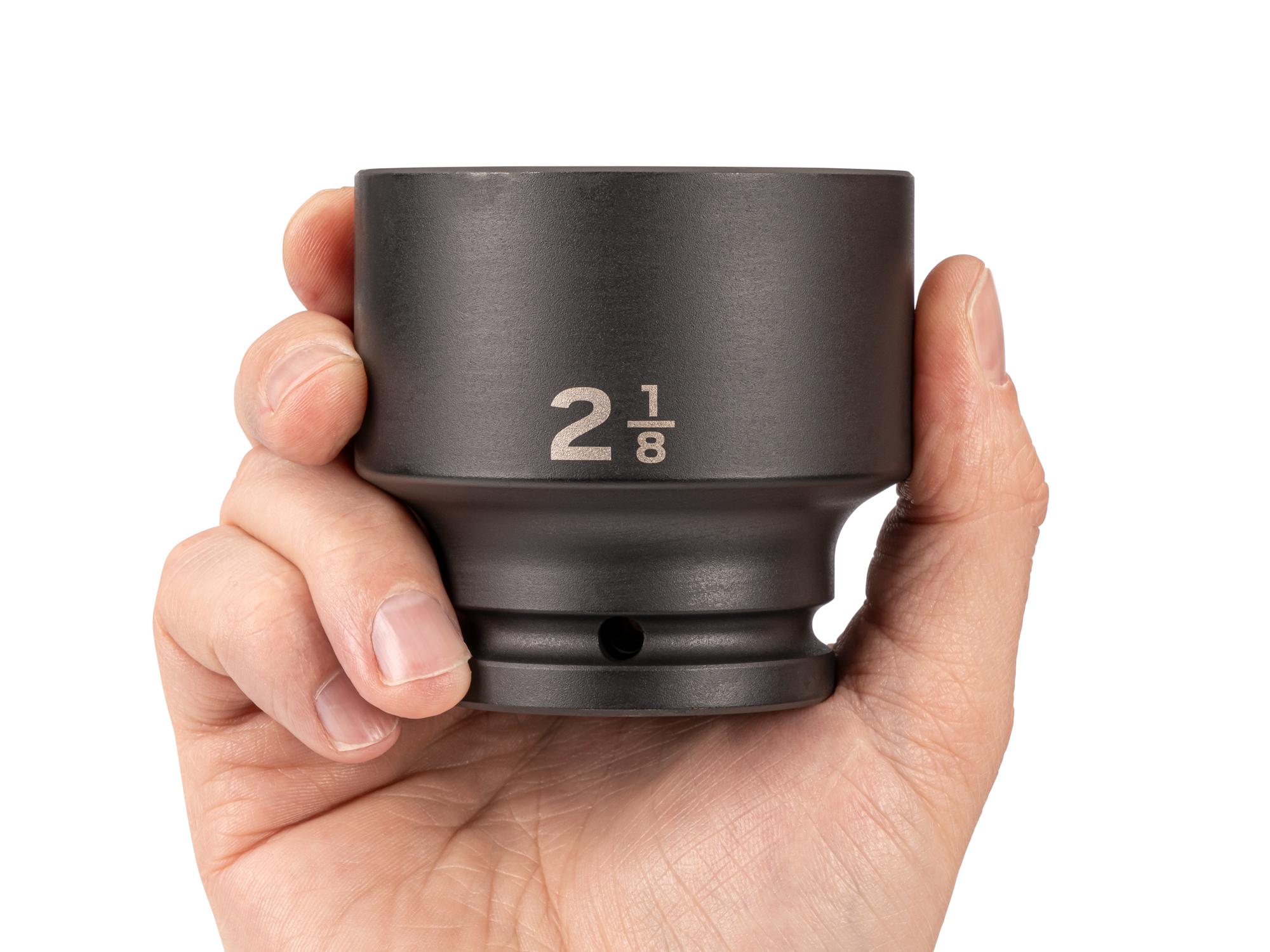 Person holding Tekton impact drive 6-point socket. Item #SID32054
