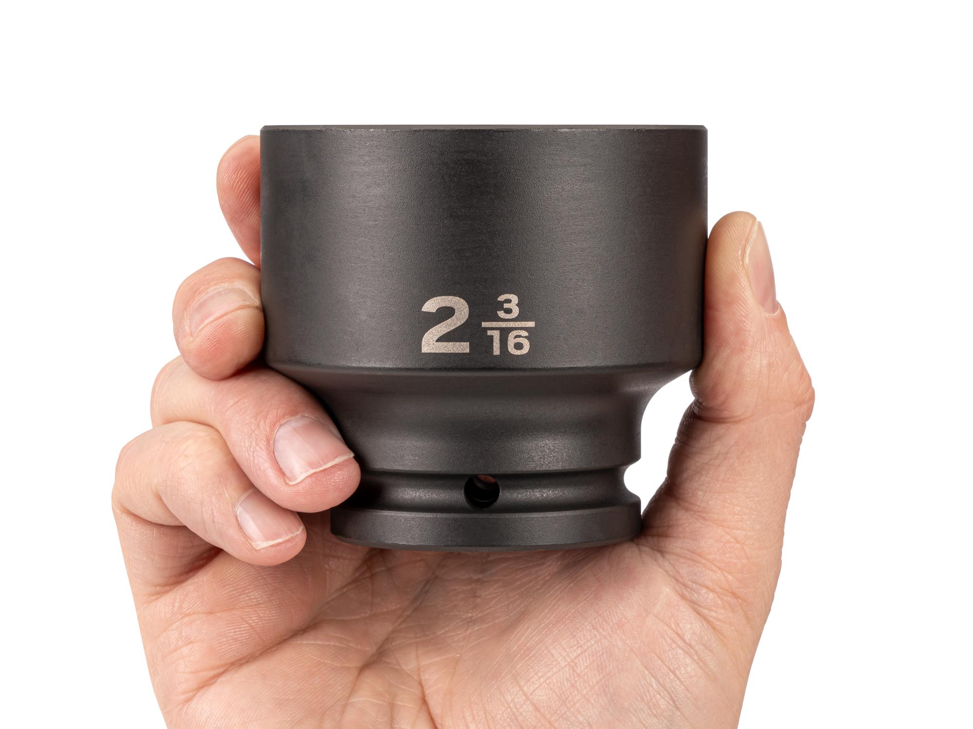 Person holding Tekton impact drive 6-point socket. Item #SID32055