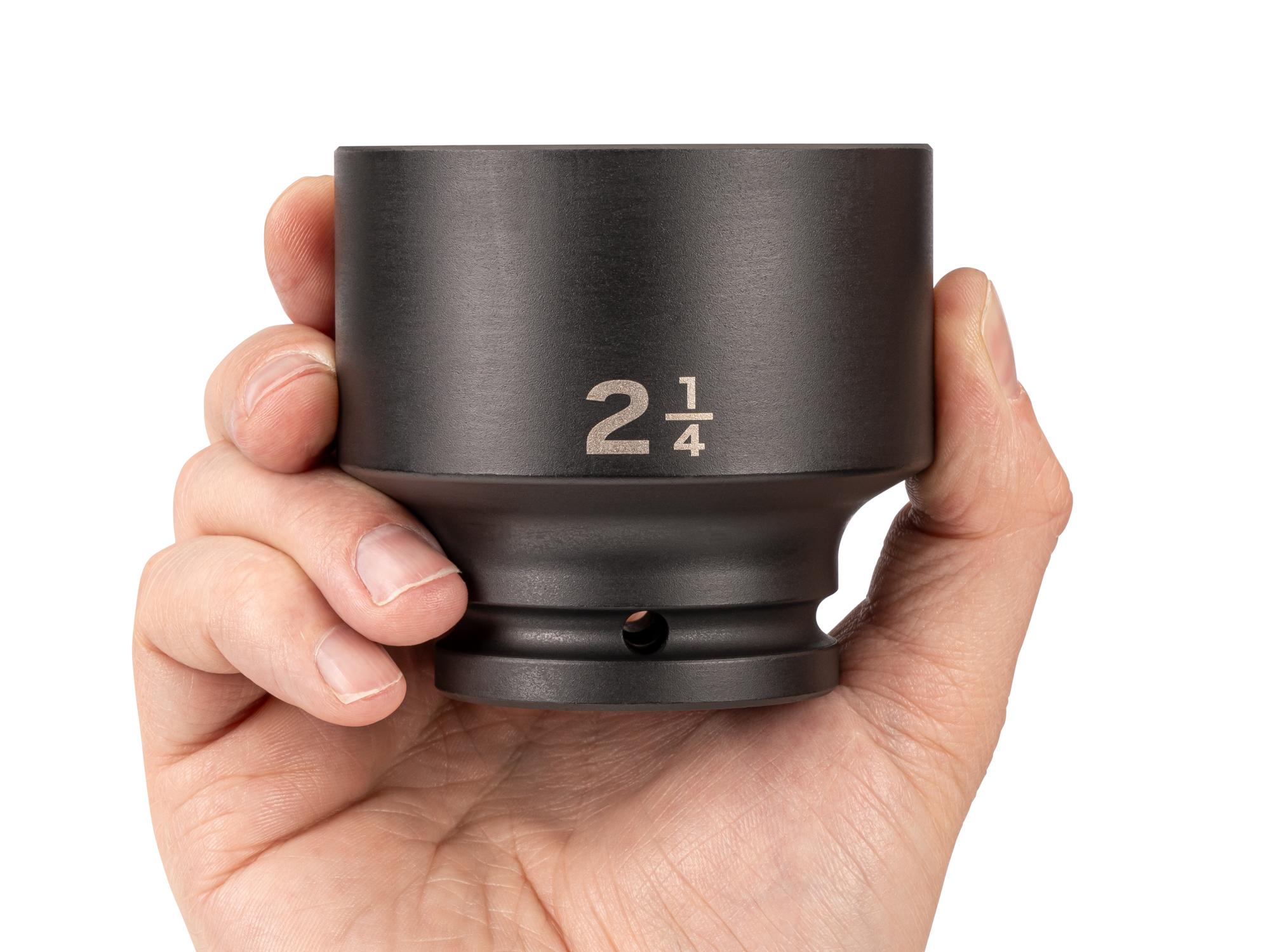 Person holding Tekton impact drive 6-point socket. Item #SID32057