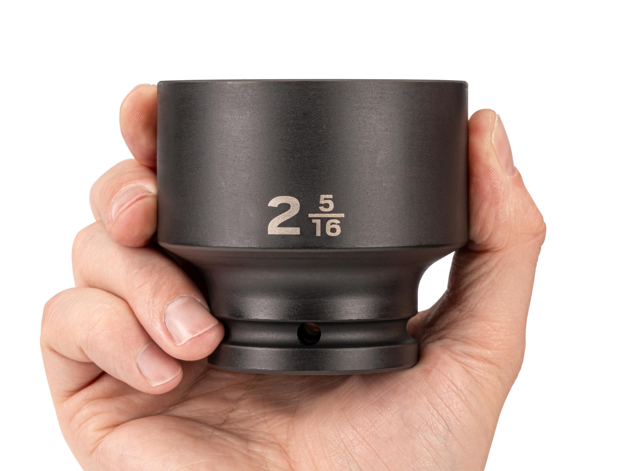 Person holding Tekton impact drive 6-point socket. Item #SID32059