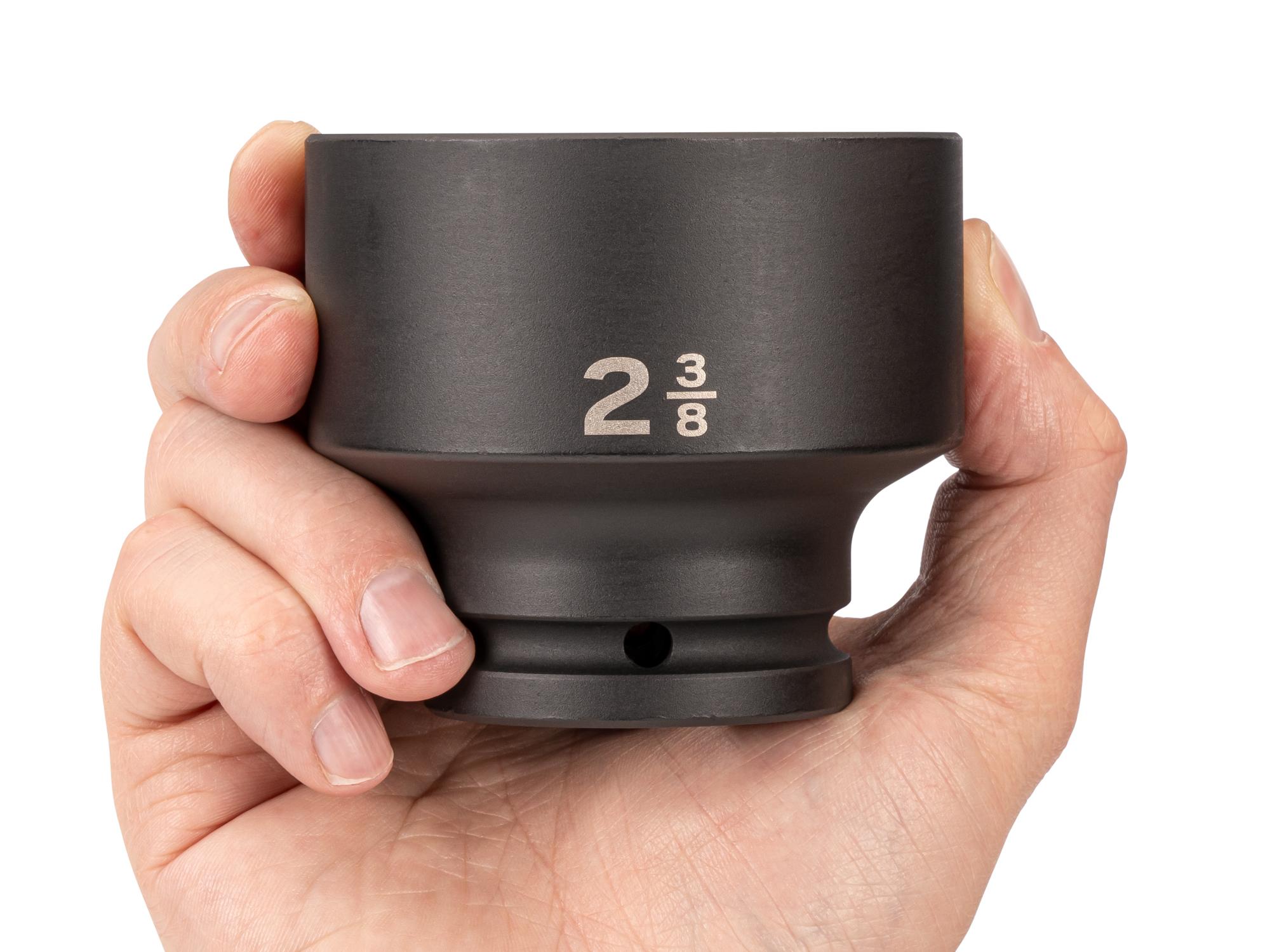Person holding Tekton impact drive 6-point socket. Item #SID32060