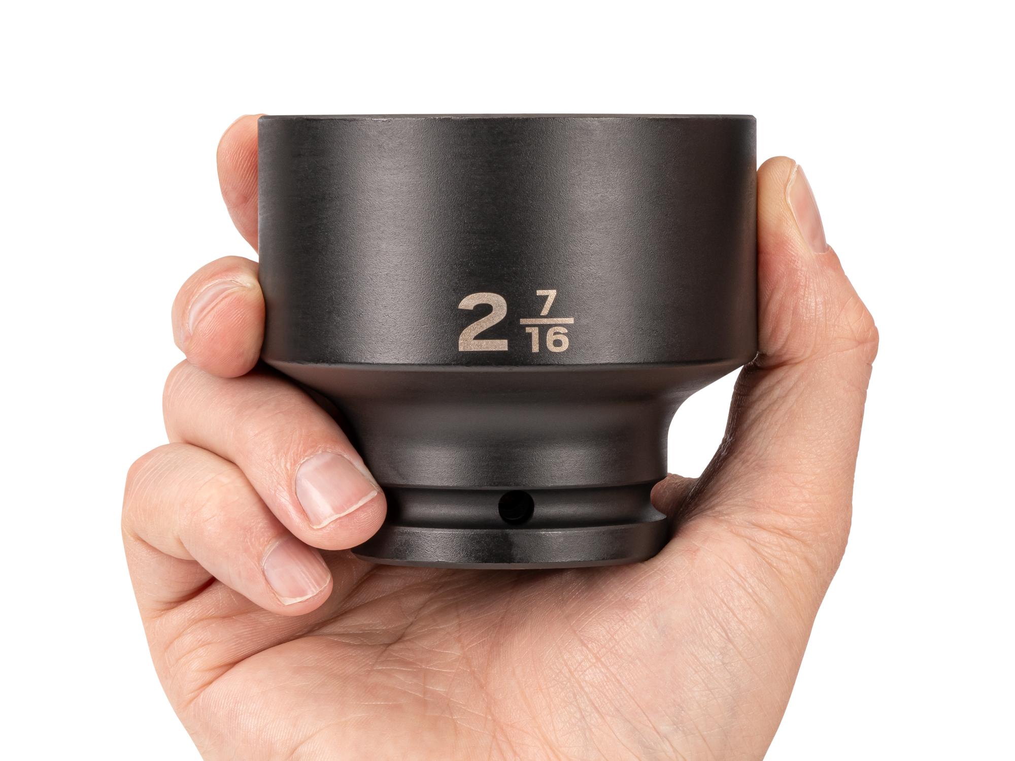 Person holding Tekton impact drive 6-point socket. Item #SID32062