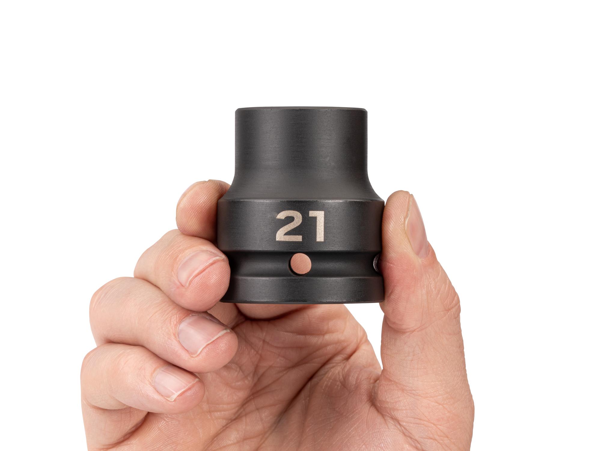 Person holding Tekton impact drive 6-point socket. Item #SID32121