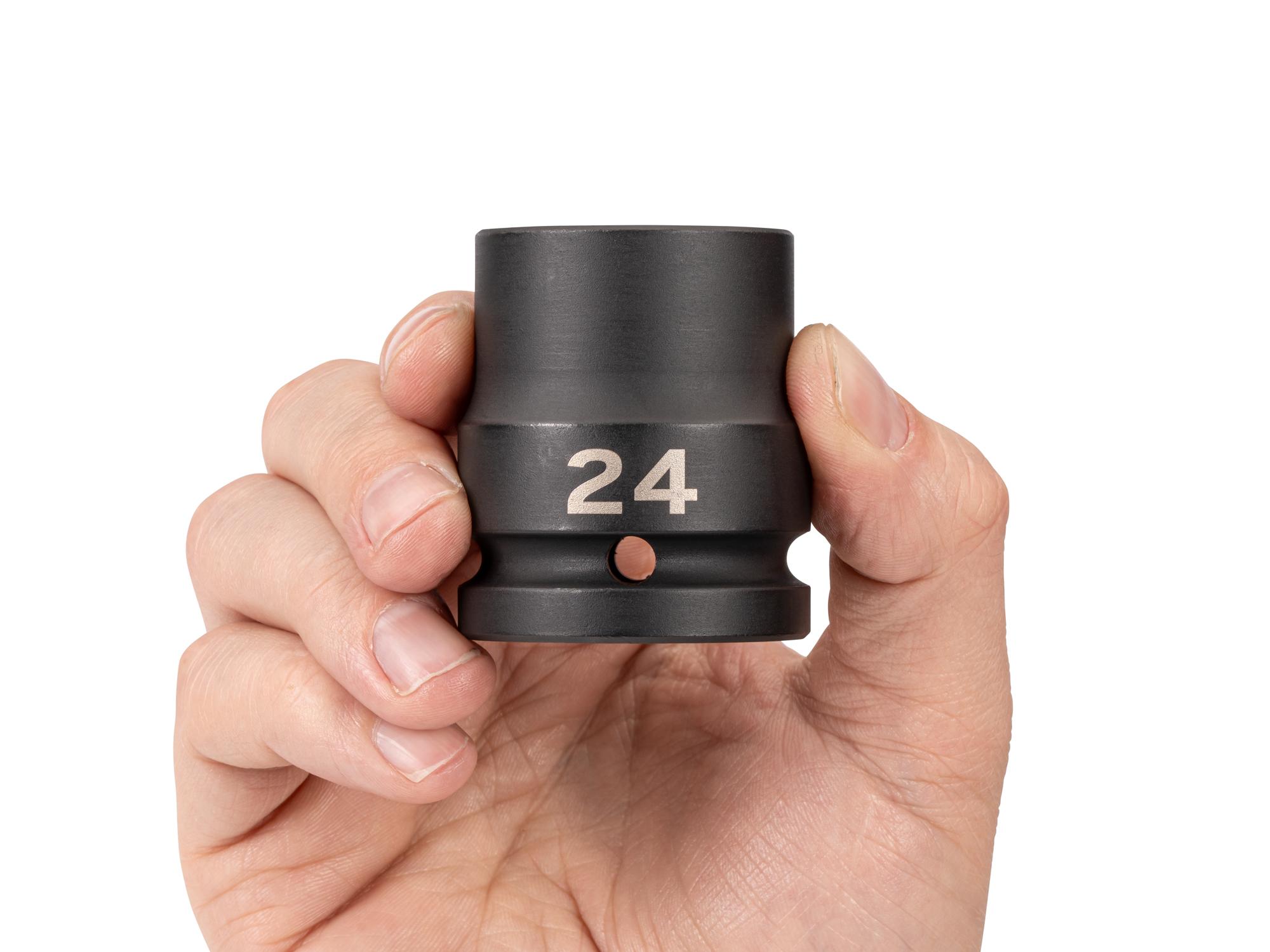 Person holding Tekton impact drive 6-point socket. Item #SID32124