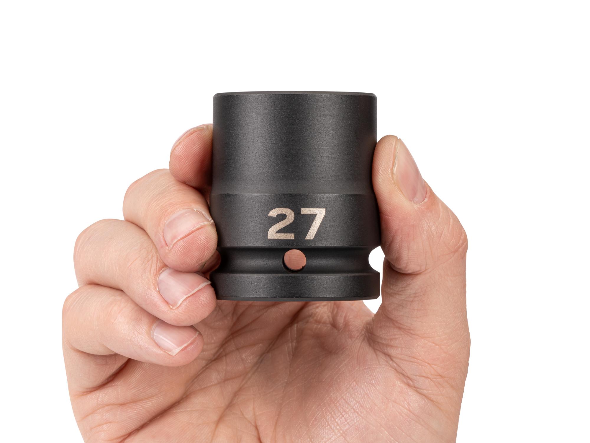 Person holding Tekton impact drive 6-point socket. Item #SID32127