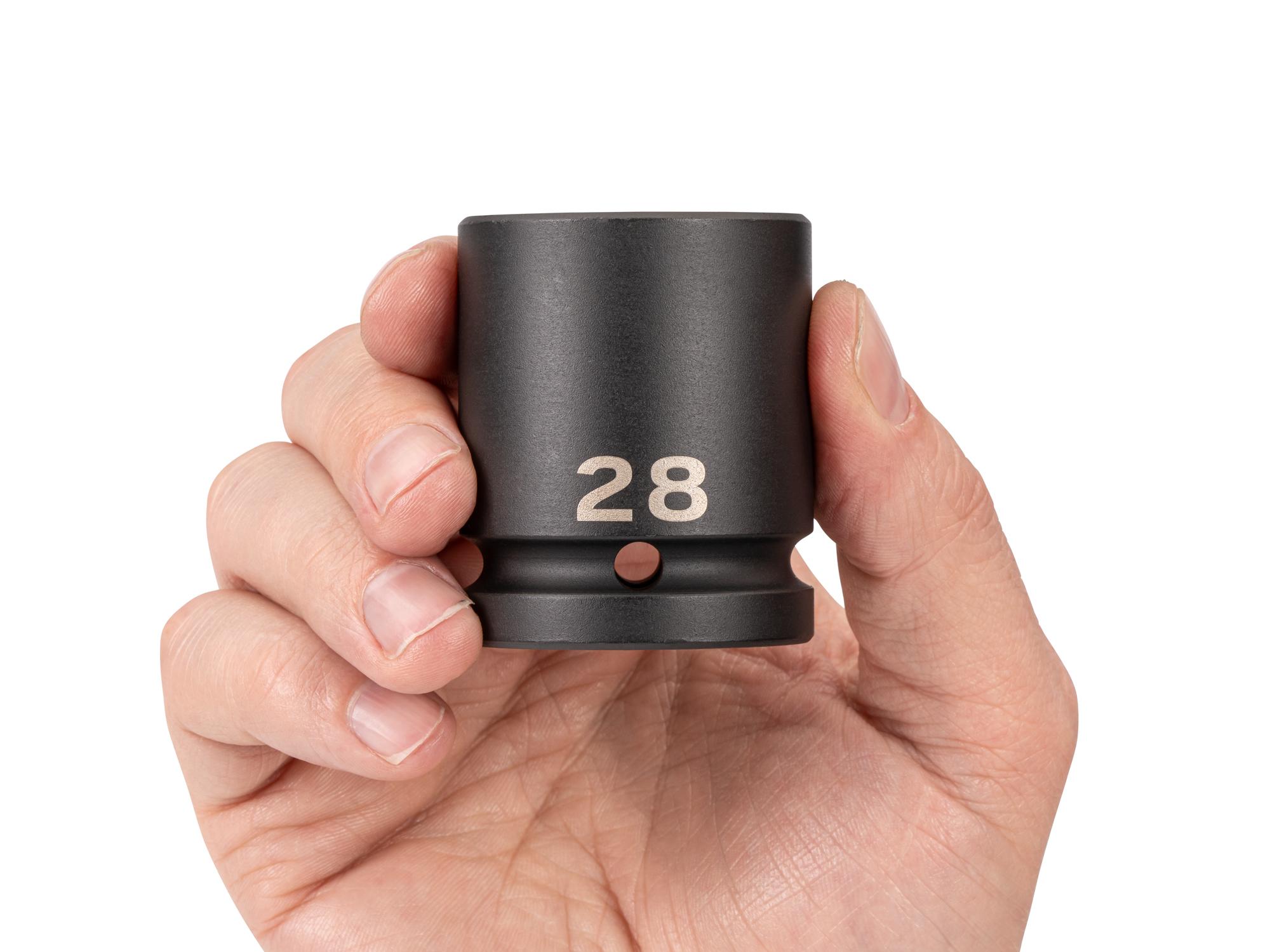 Person holding Tekton impact drive 6-point socket. Item #SID32128