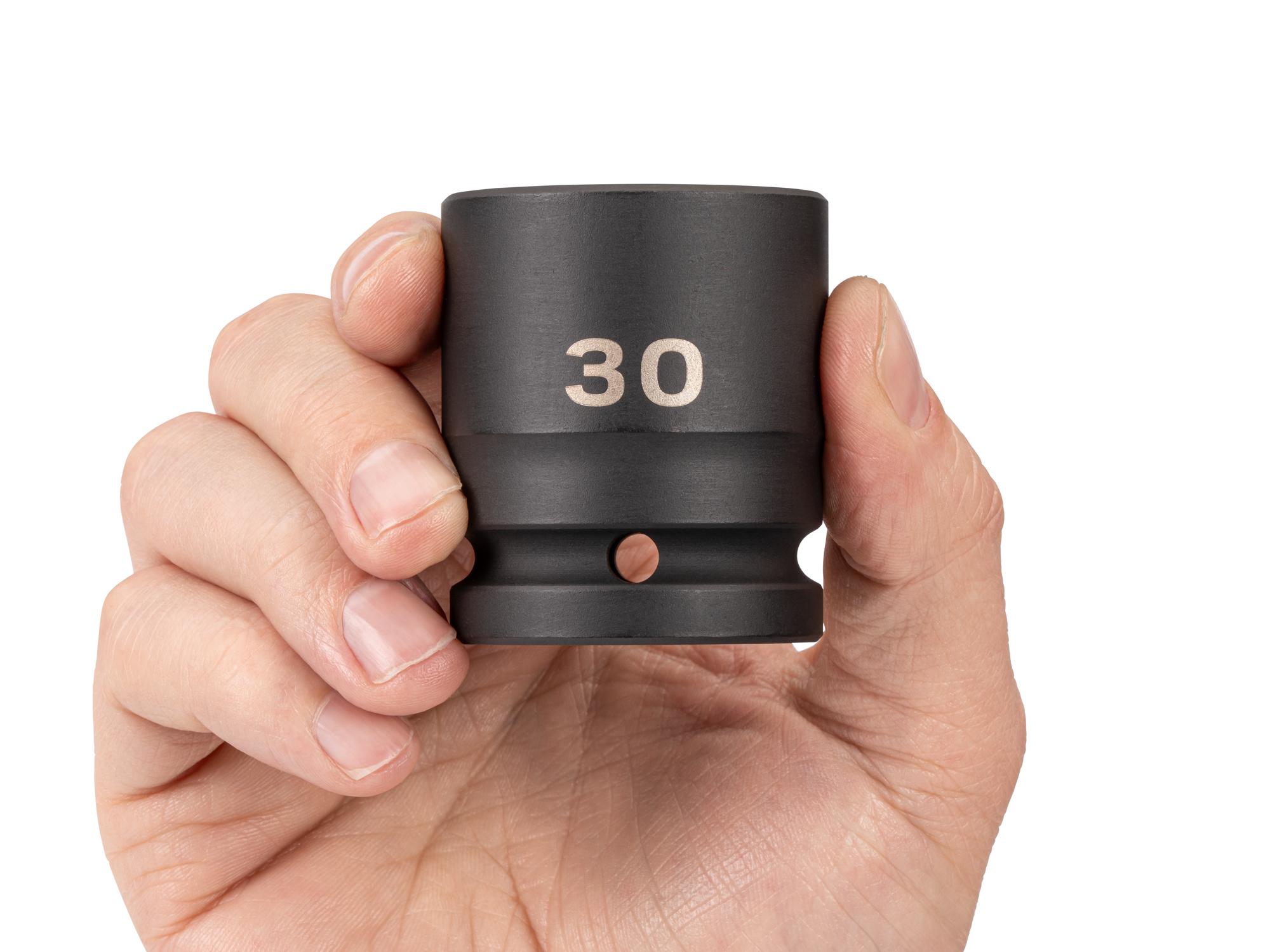 Person holding Tekton impact drive 6-point socket. Item #SID32130