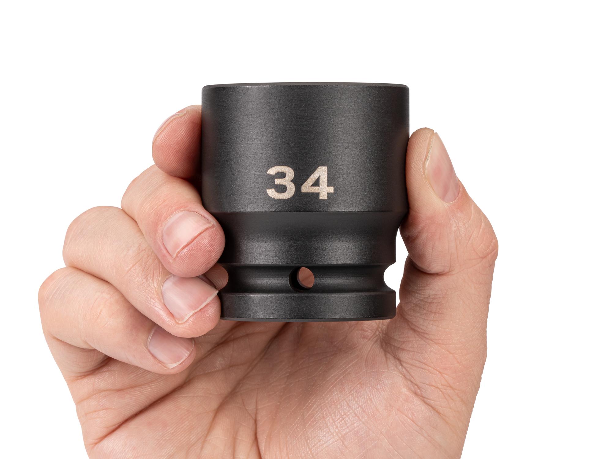 Person holding Tekton impact drive 6-point socket. Item #SID32134
