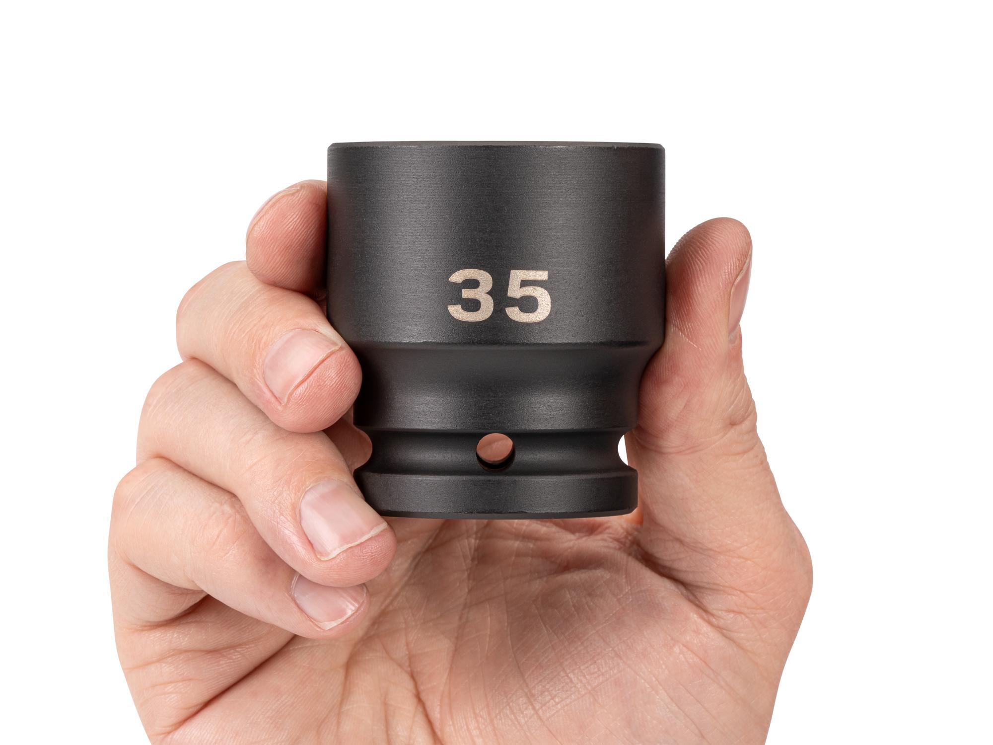 Person holding Tekton impact drive 6-point socket. Item #SID32135