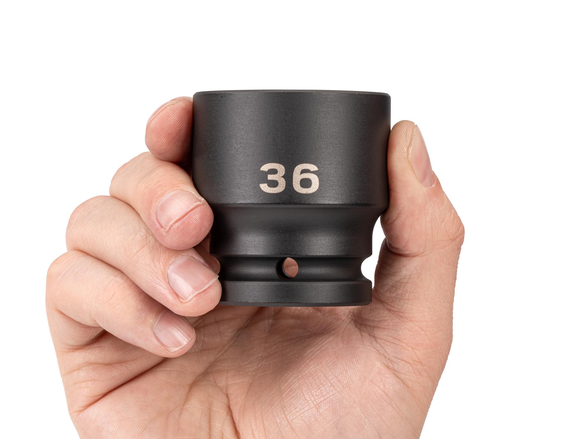 Person holding Tekton impact drive 6-point socket. Item #SID32136