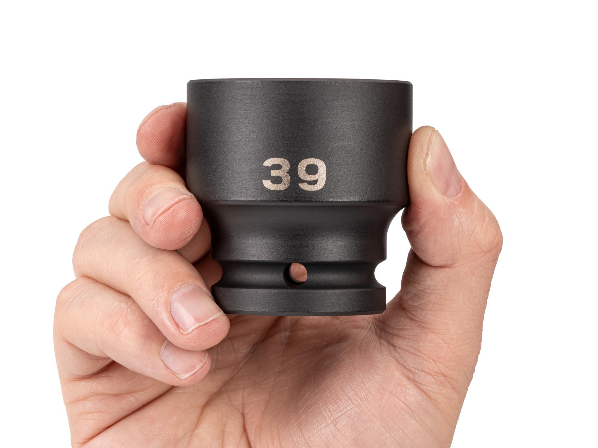 Person holding Tekton impact drive 6-point socket. Item #SID32139