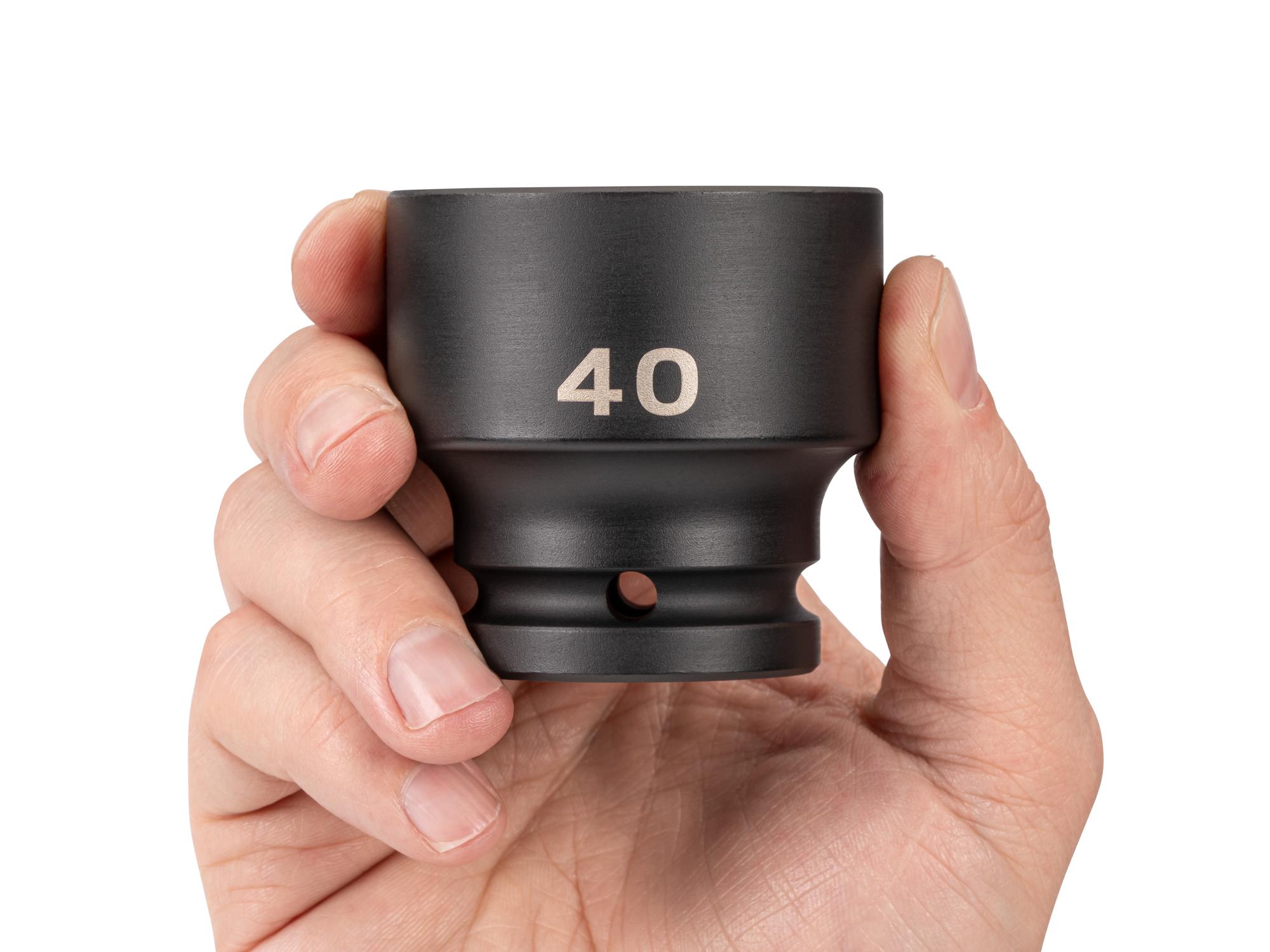 Person holding Tekton impact drive 6-point socket. Item #SID32140
