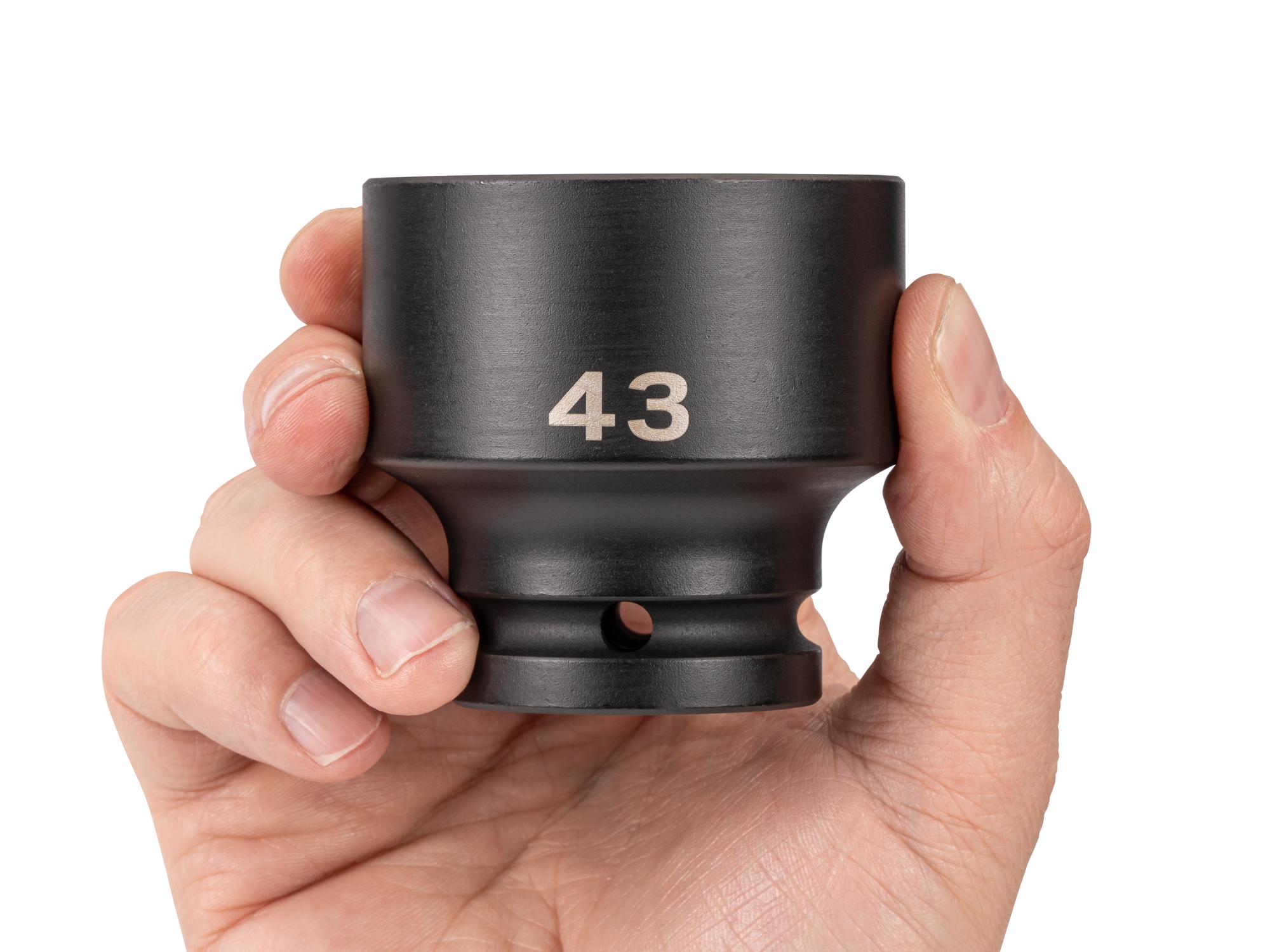 Person holding Tekton impact drive 6-point socket. Item #SID32143