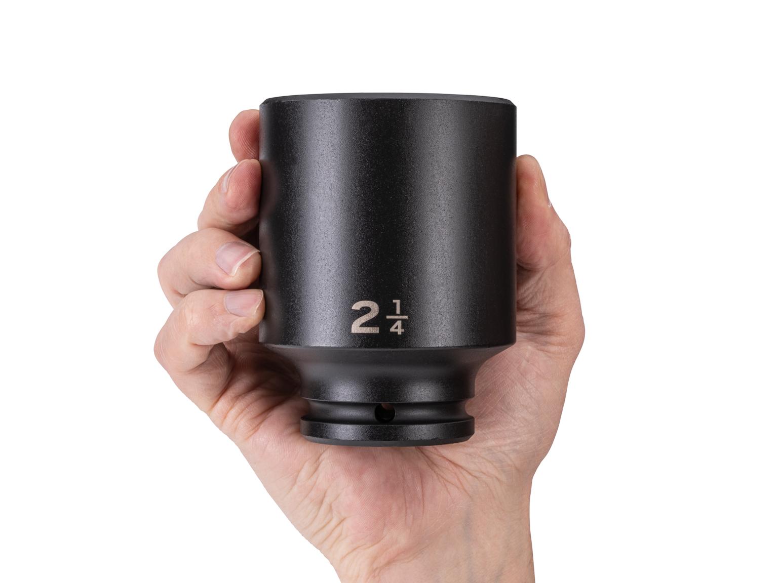 Person holding Tekton impact drive 6-point socket. Item #SID33057