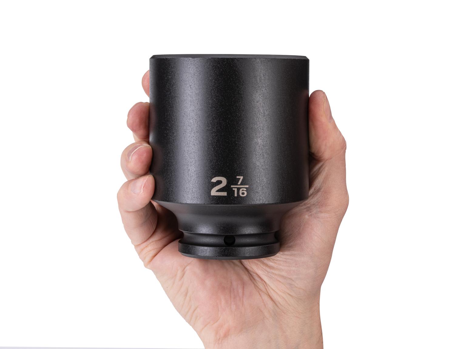 Person holding Tekton impact drive 6-point socket. Item #SID33062