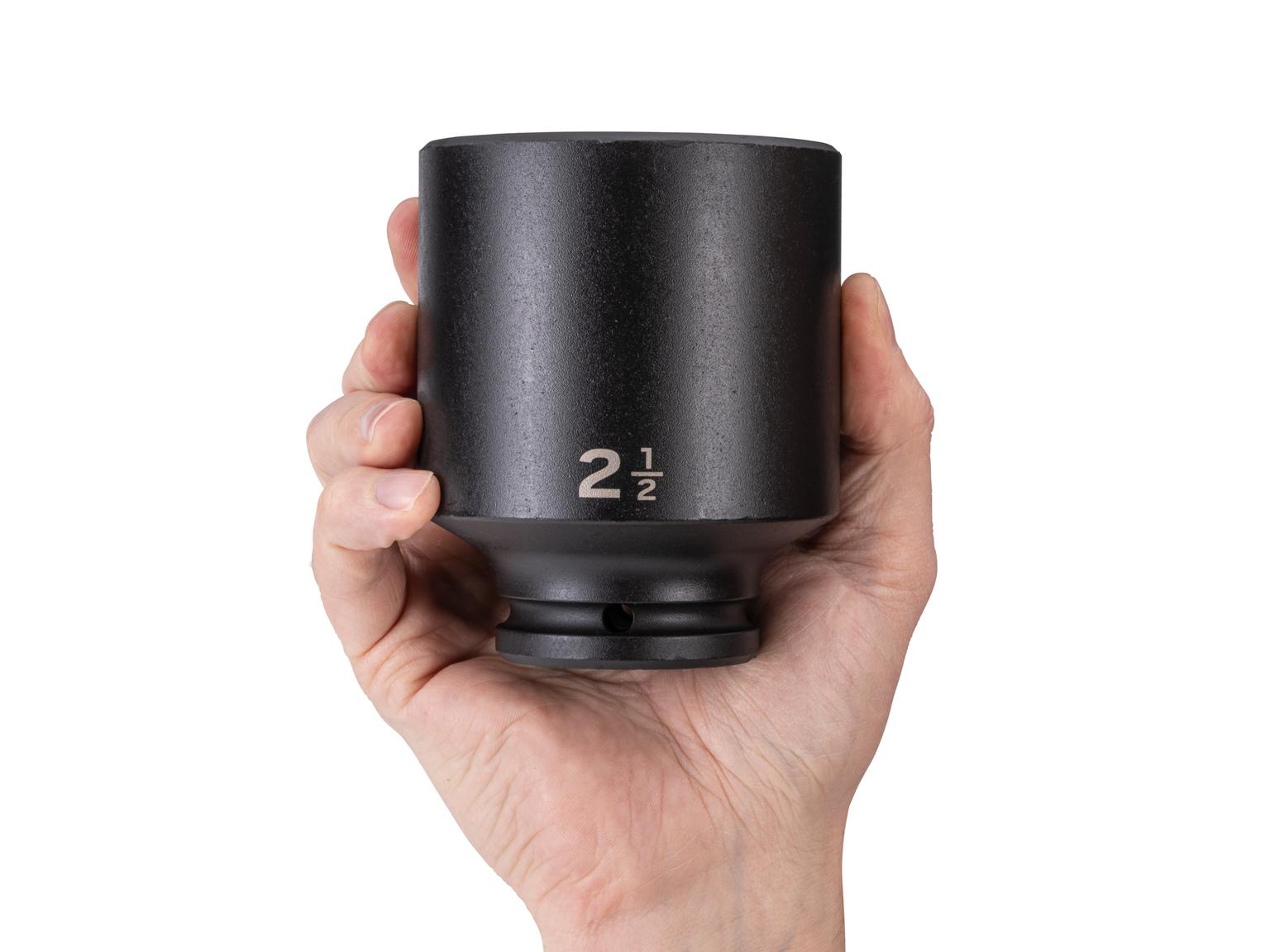 Person holding Tekton impact drive 6-point socket. Item #SID33063